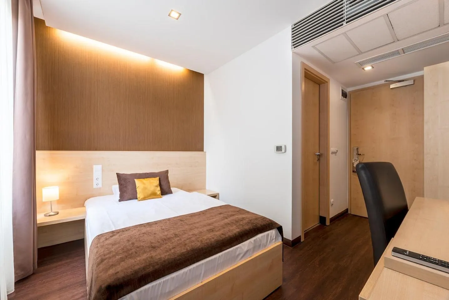 Bed in Promenade City Hotel