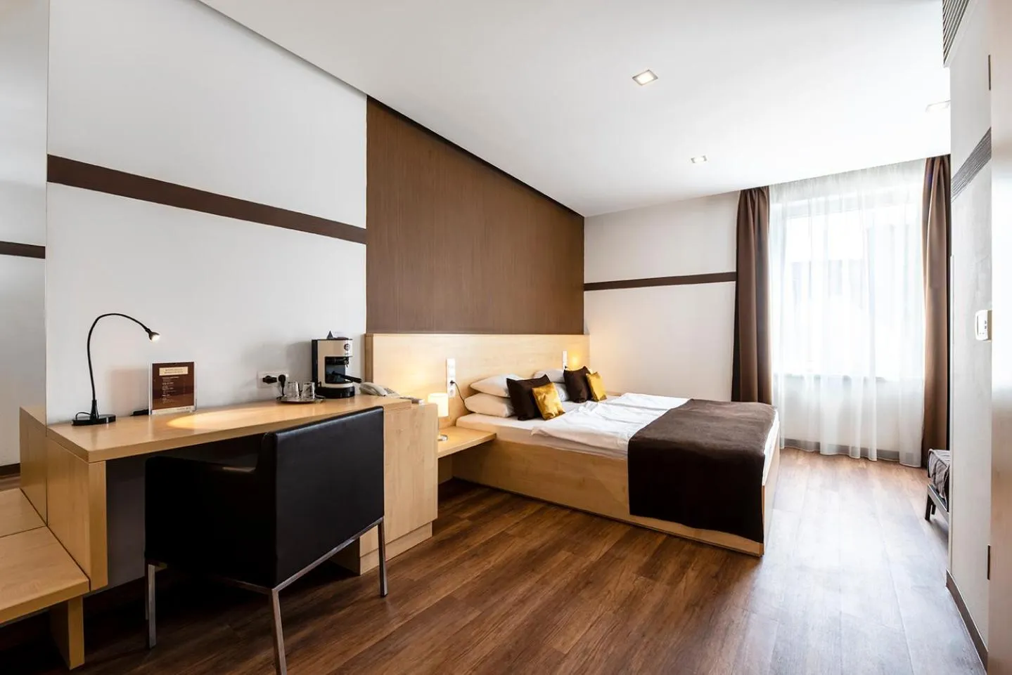 Photo of the whole room, Bed in Promenade City Hotel