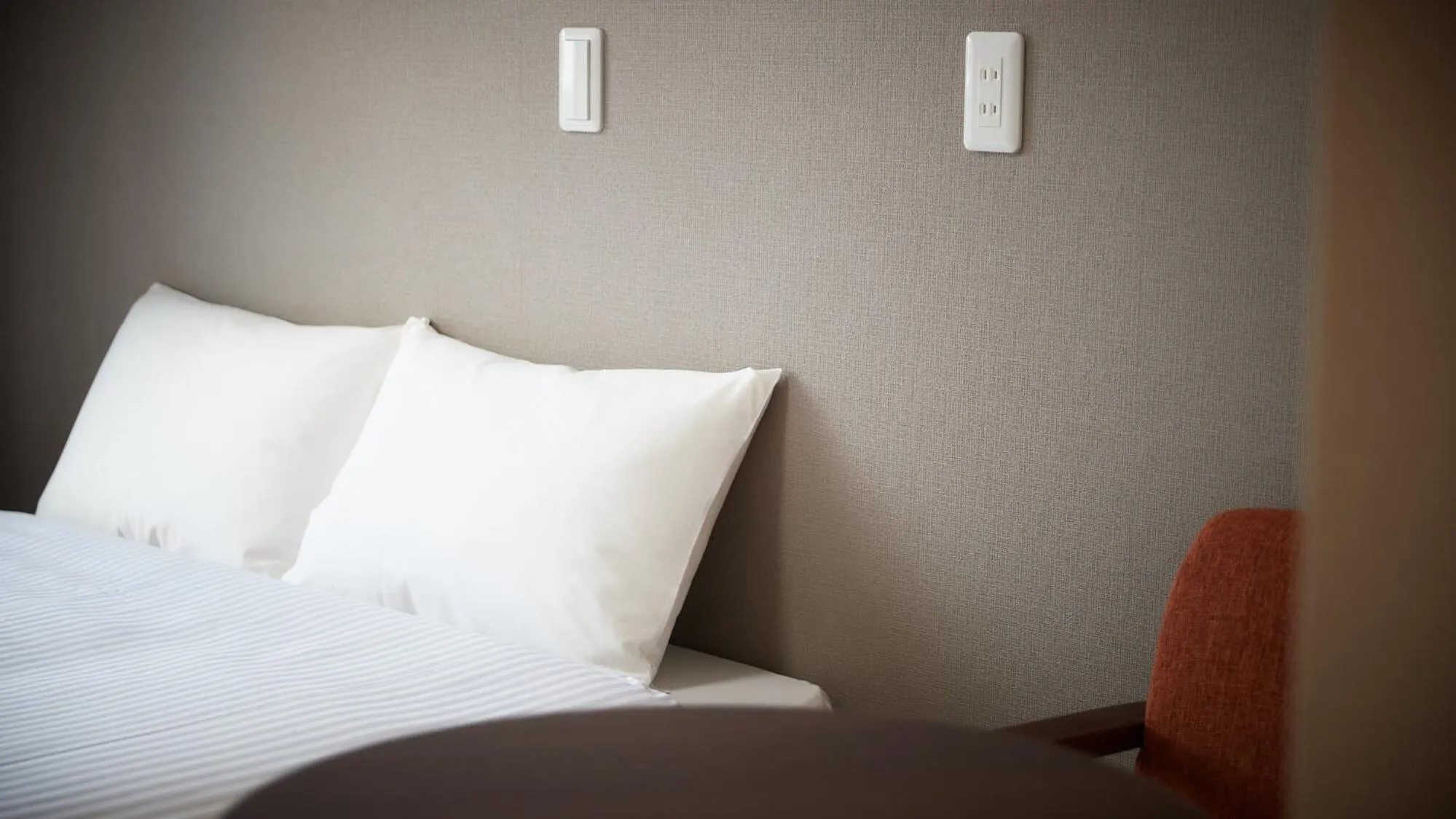 Bed in New Normal Hotel in MATSUYAMA ニューノーマルホテルイン松山