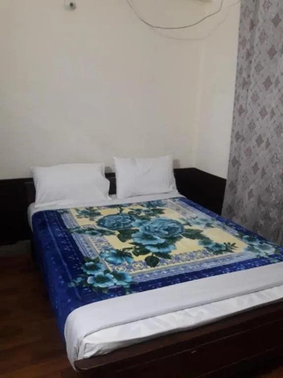 Bed in Hotel Deewan-E-Aziz Internationa