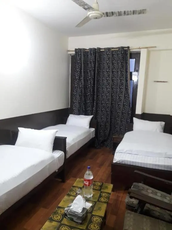 Bed in Hotel Deewan-E-Aziz Internationa