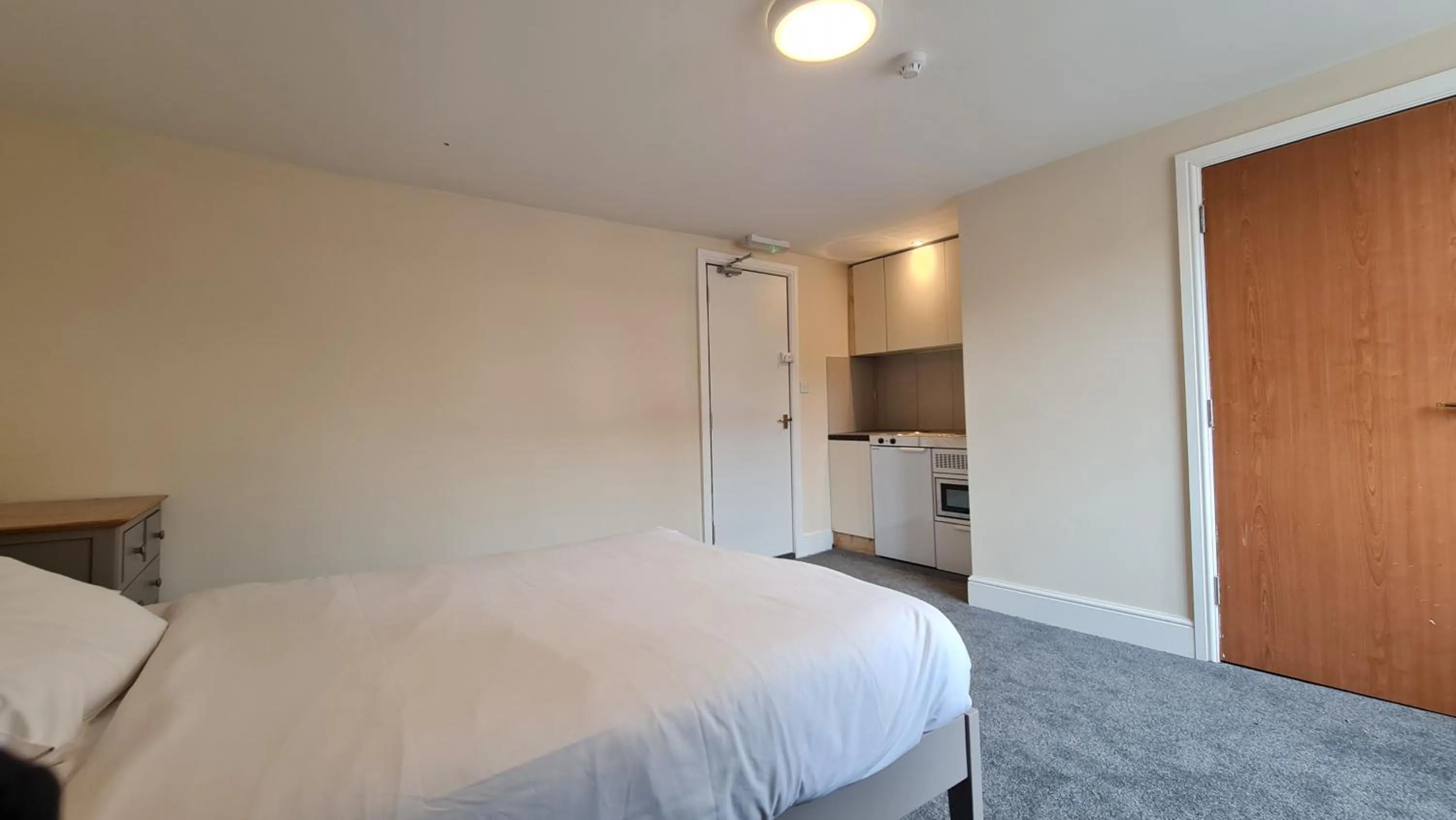 Bedroom, Bed in Grace Apartments - Living Rock