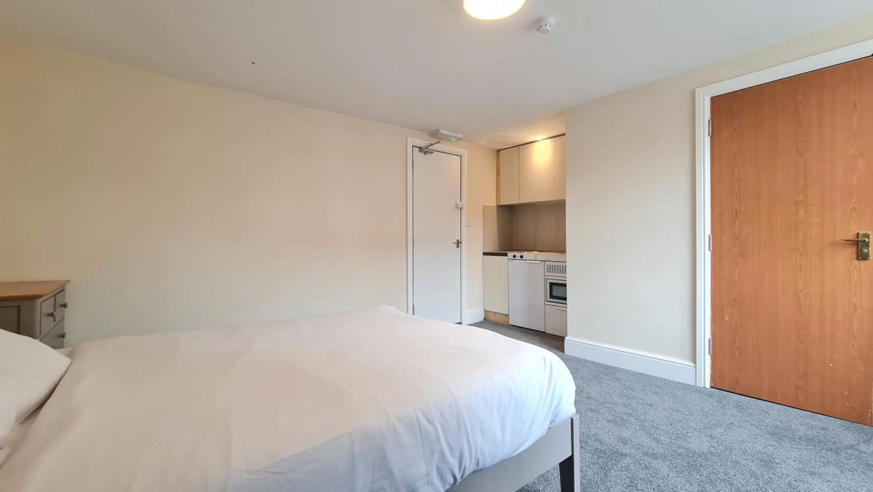 Bedroom, Bed in Grace Apartments - Living Rock