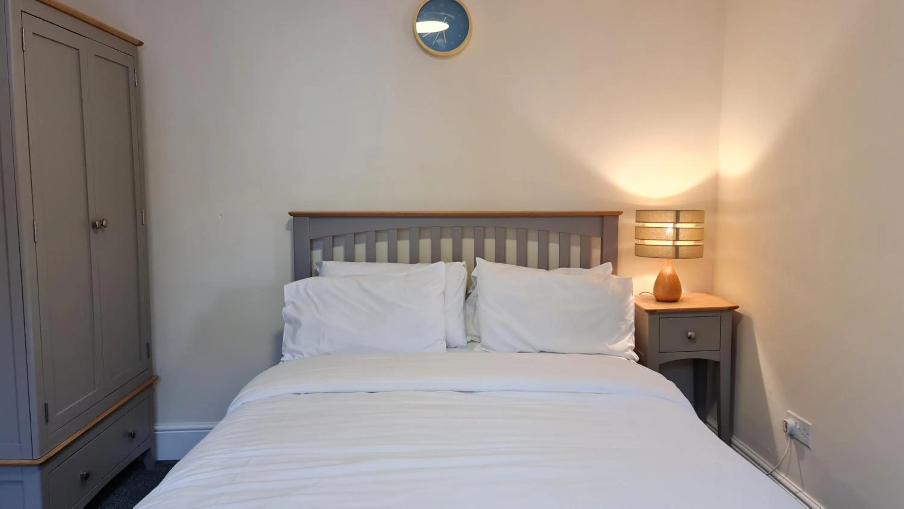 Bedroom, Bed in Grace Apartments - Living Rock