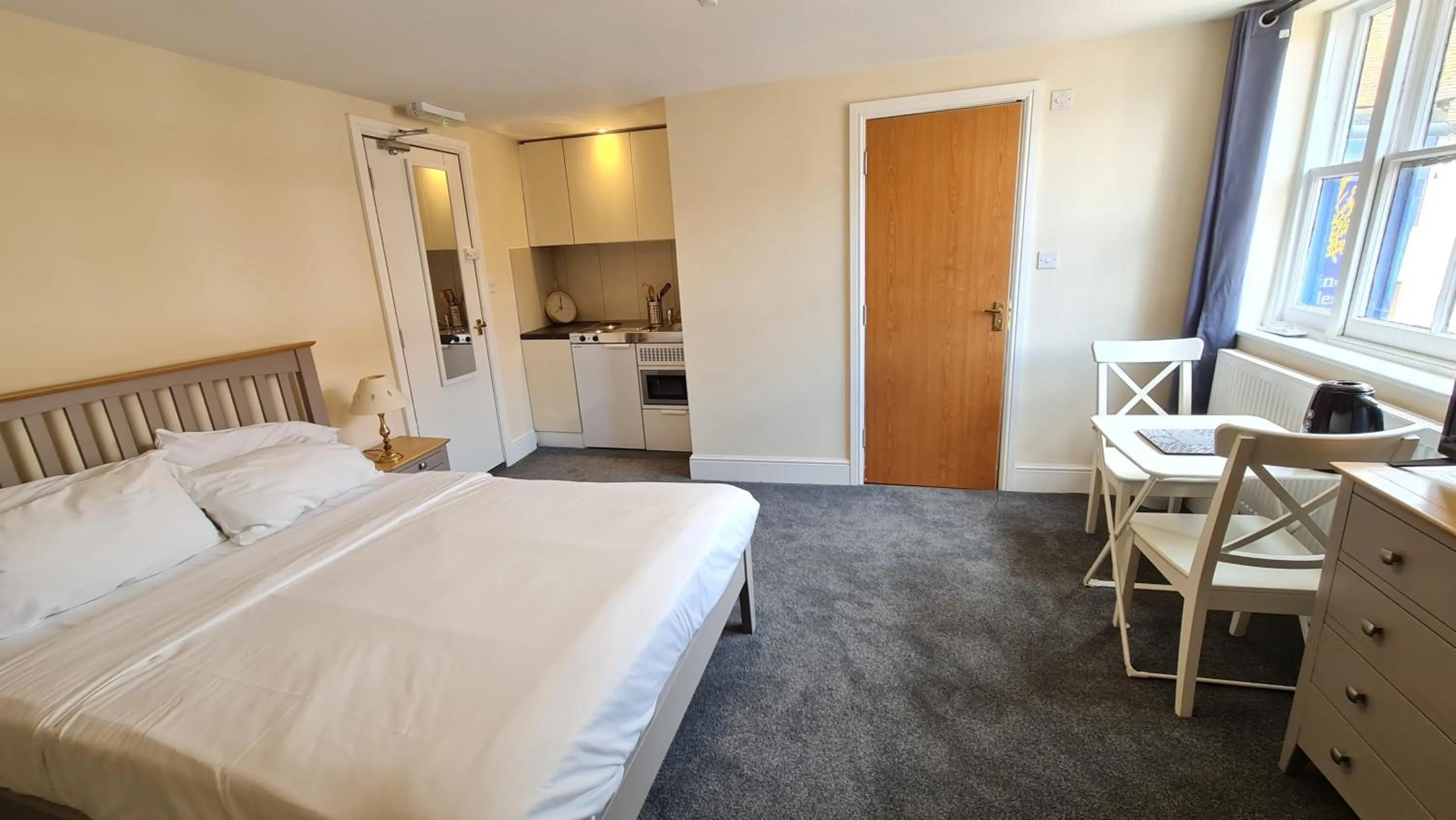 Bedroom, Bed in Grace Apartments - Living Rock