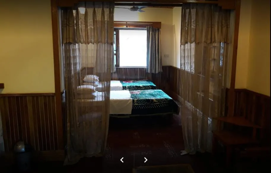 Bed in Greens Hotel Kalam