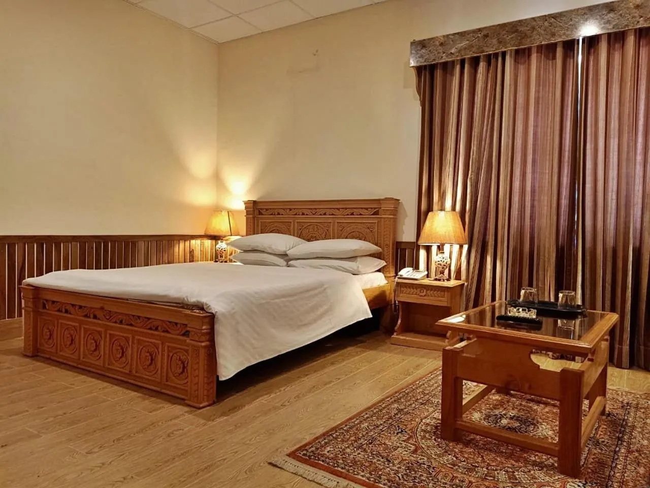 Bed in Greens Hotel Kalam
