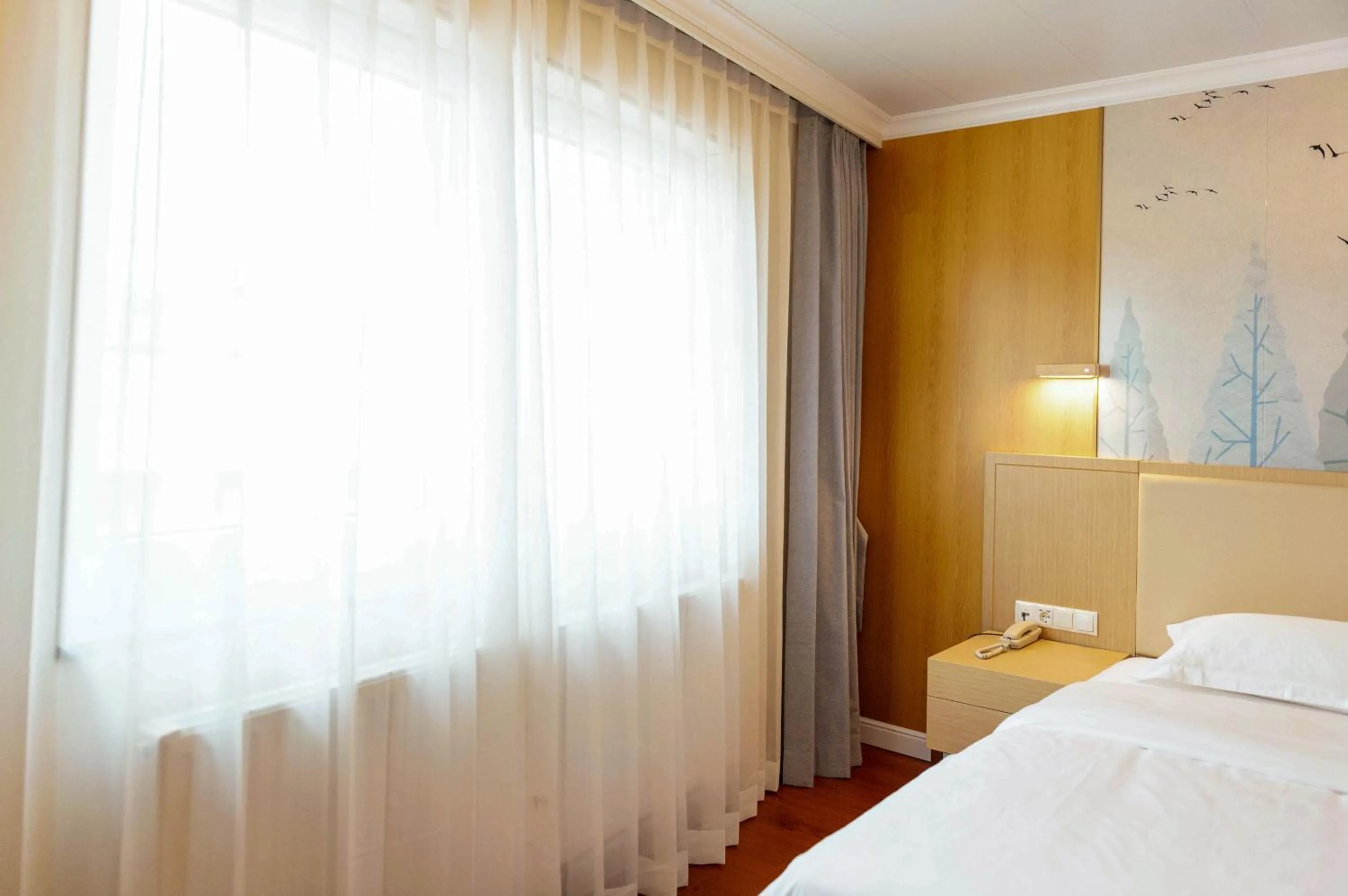 Bed in Mr.Liao Hotel