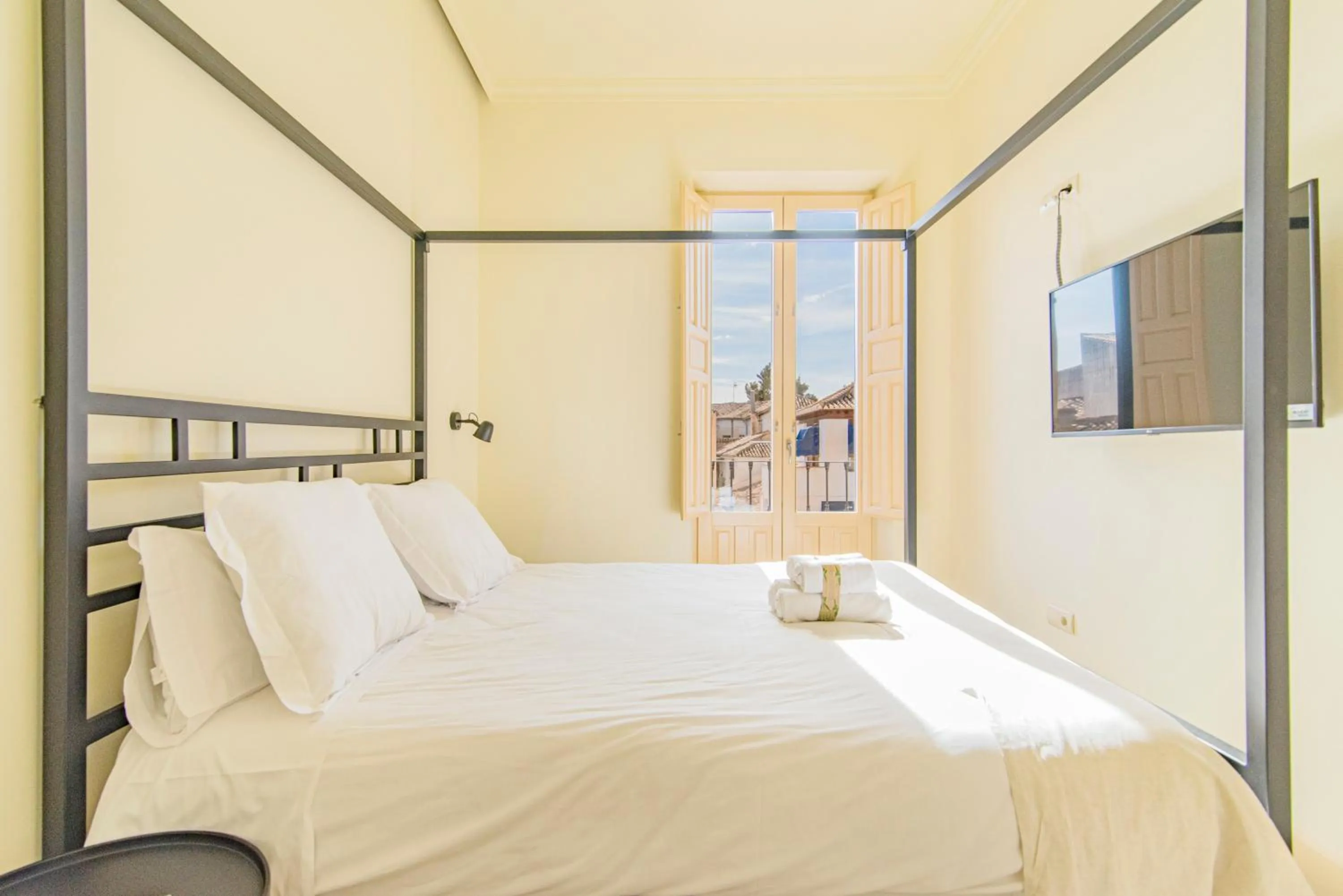 Bed in Mosaiko Homes Catedral Granada