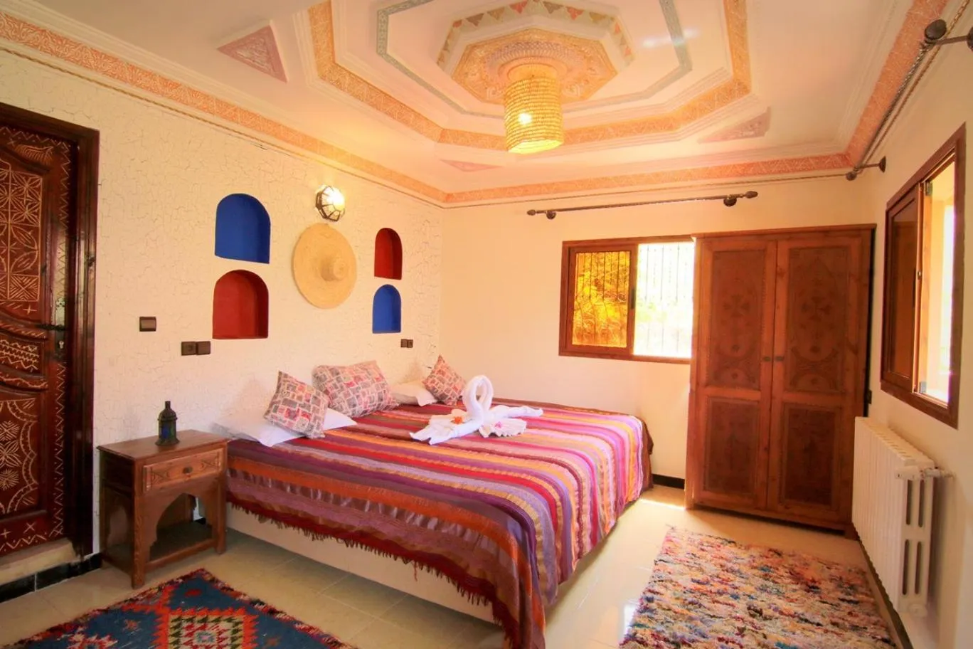 Photo of the whole room, Bed in Jnane Karma