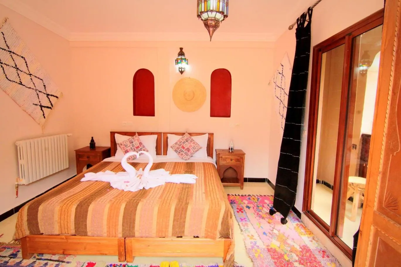 Photo of the whole room, Bed in Jnane Karma