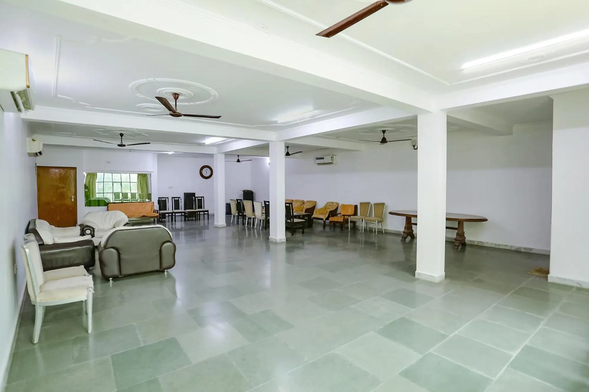 Seating area in FabHotel Premium Rooms - Nr Yashobhoomi Convention Centre