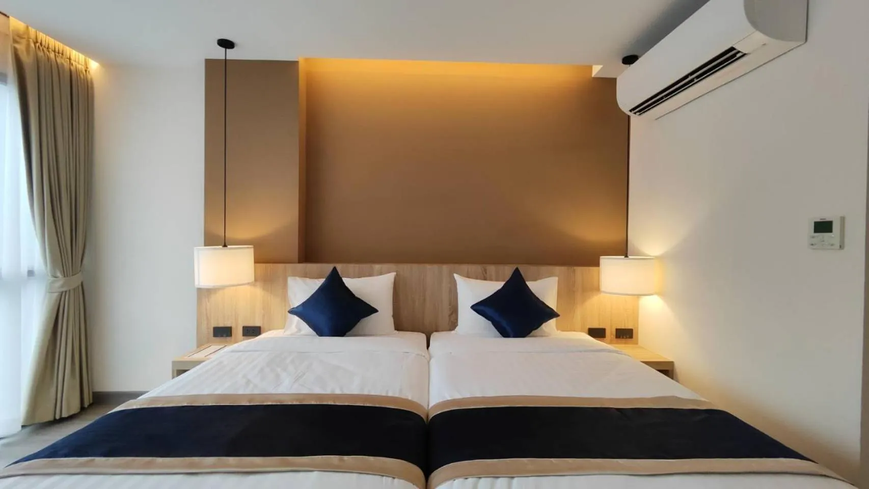 Bed in Hi Chiangmai Hotel