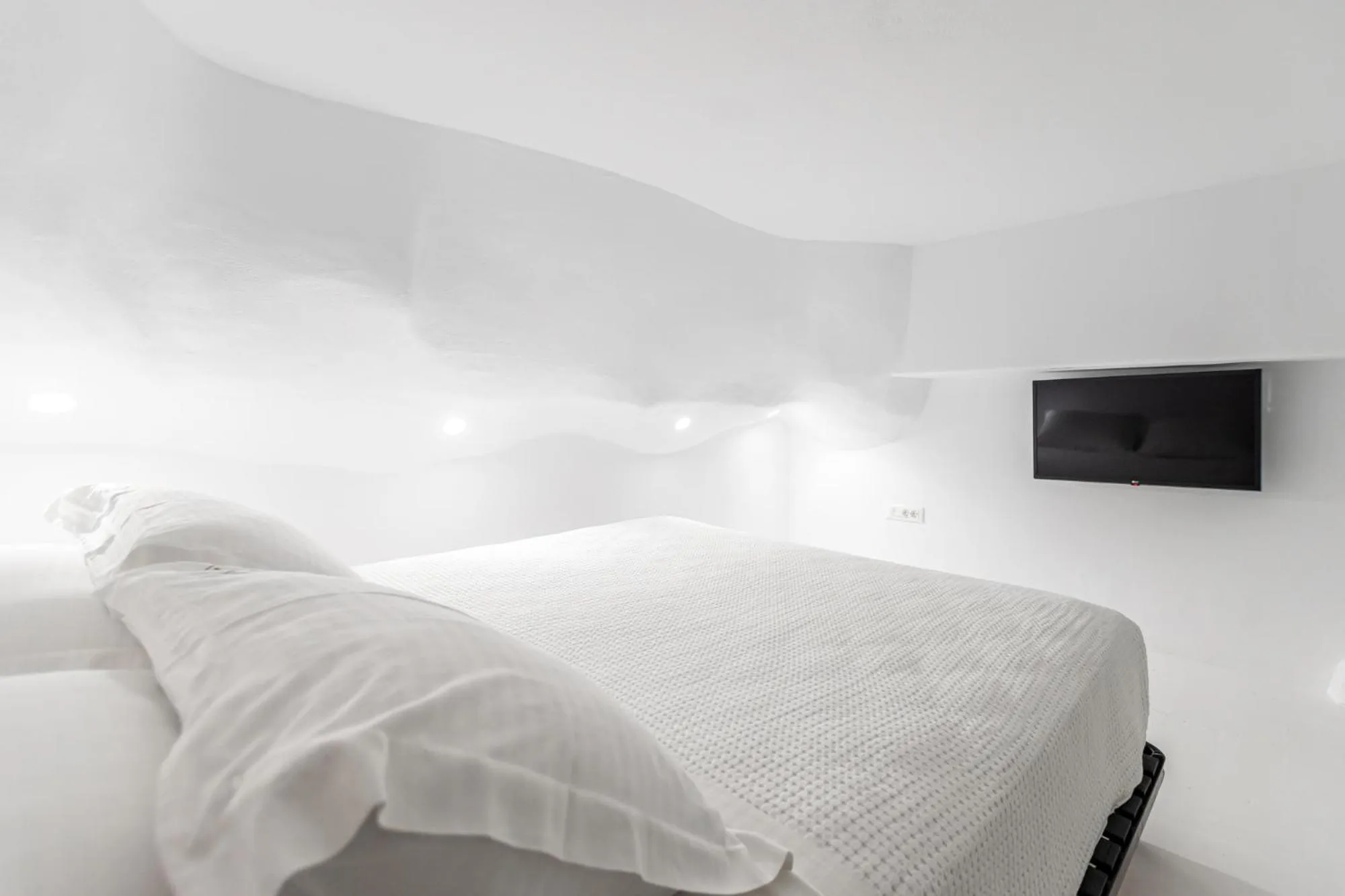 Bed in Majo Suites Hotel