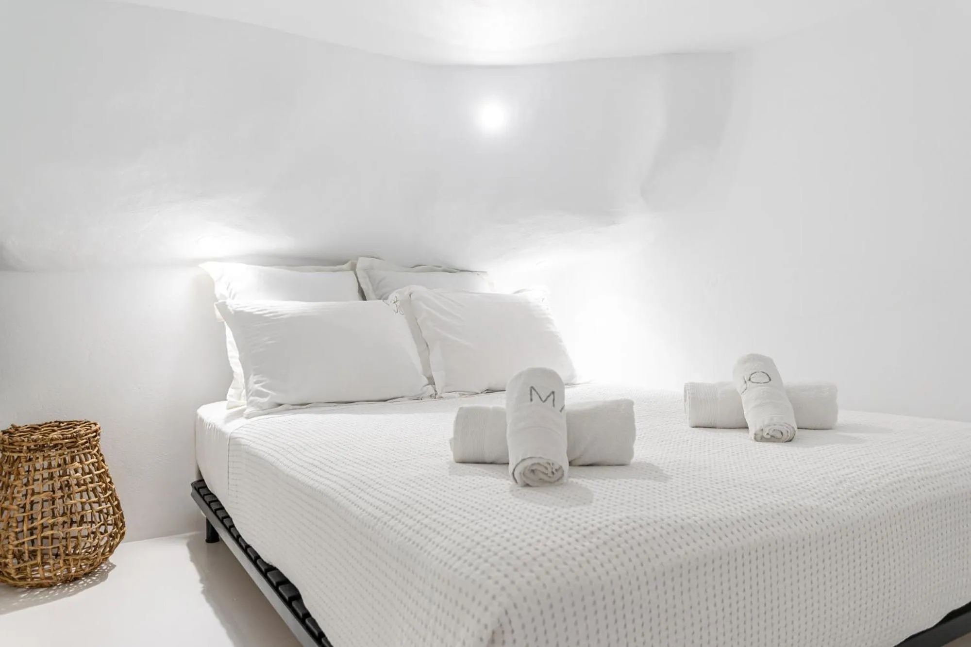 Bed in Majo Suites Hotel