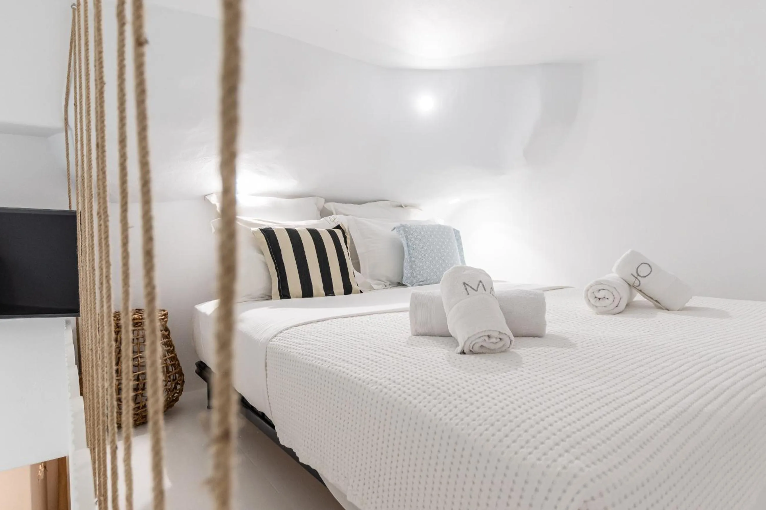 Bed in Majo Suites Hotel