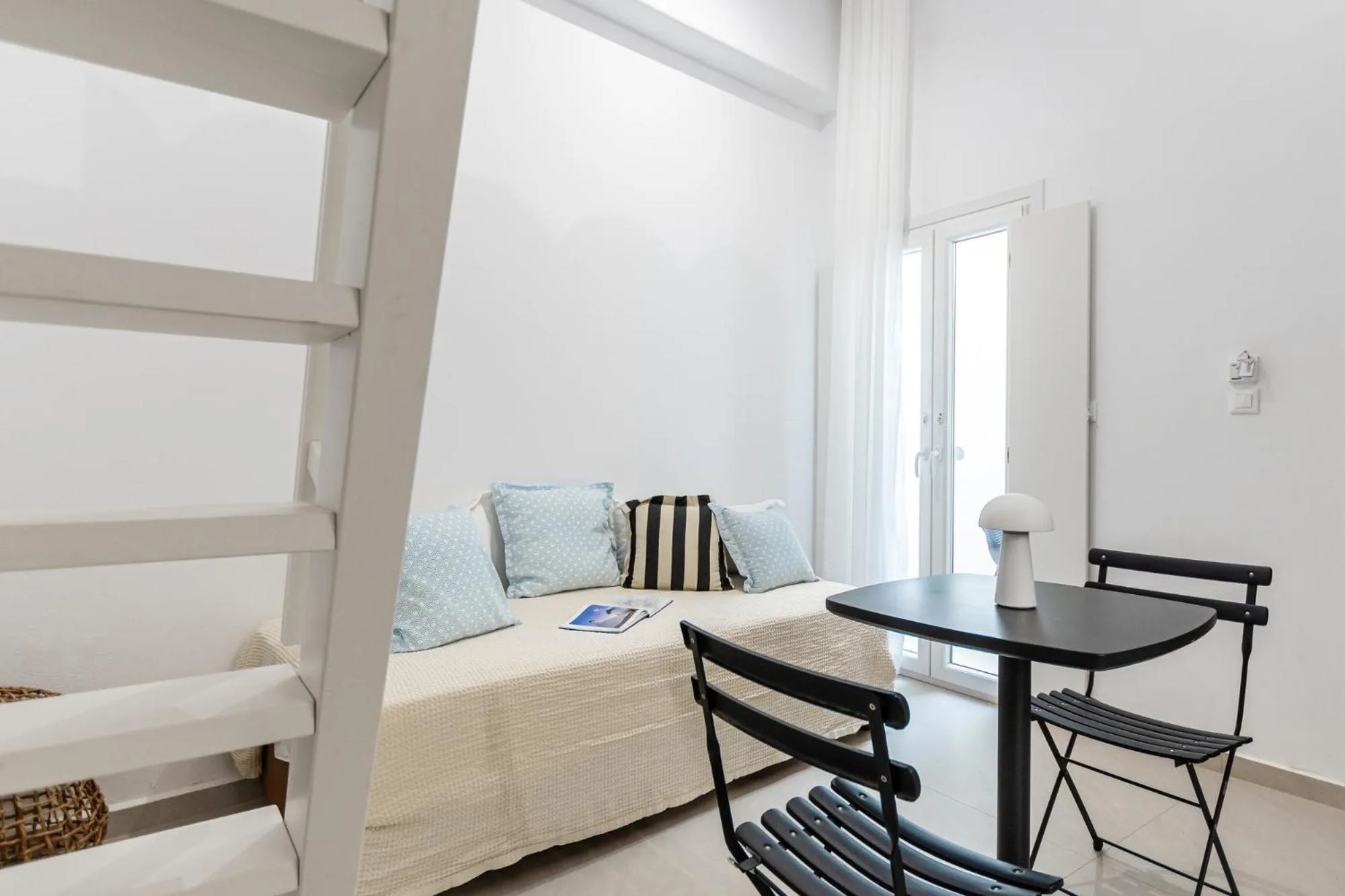 Bed in Majo Suites Hotel