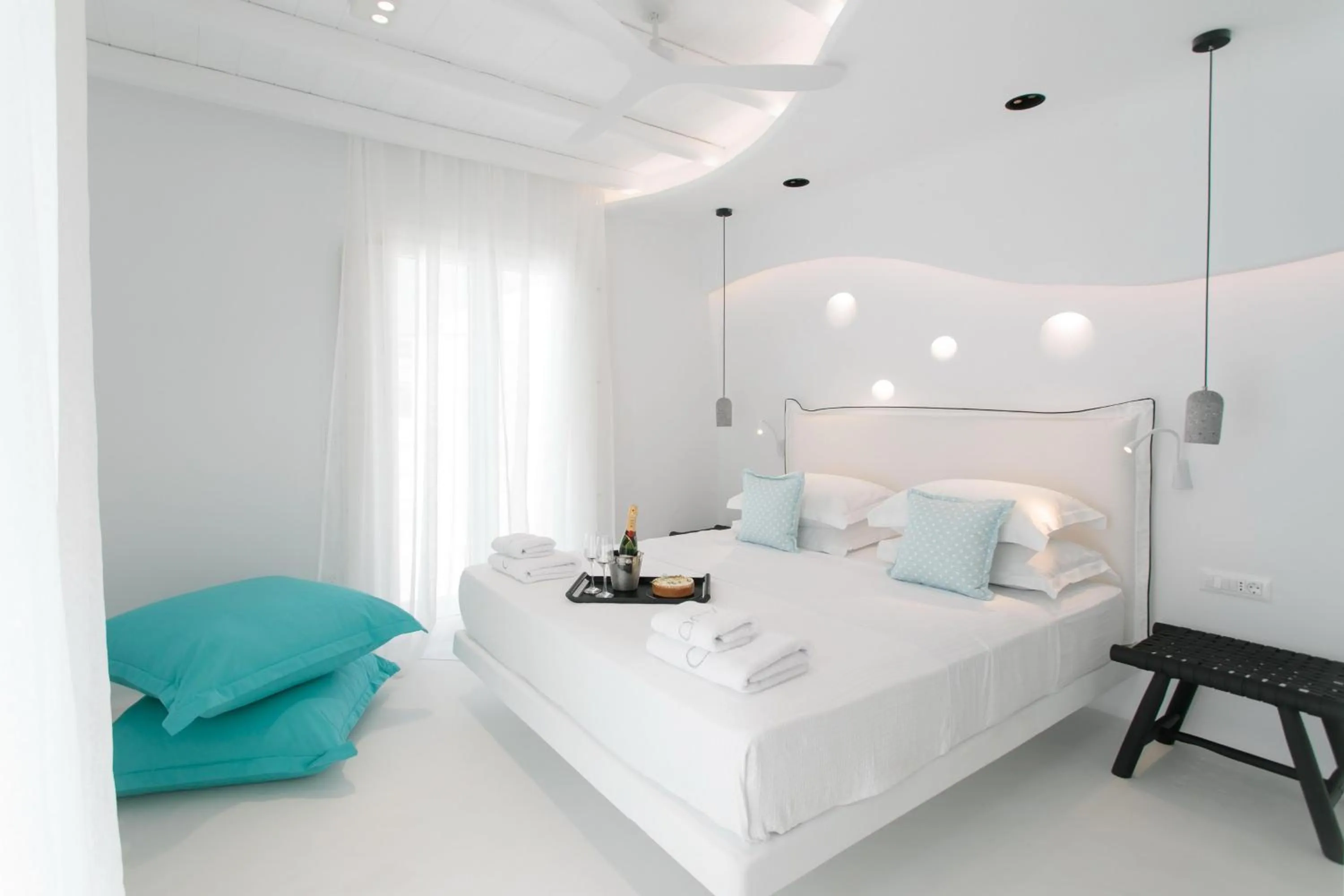 Patio, Bed in Majo Suites Hotel