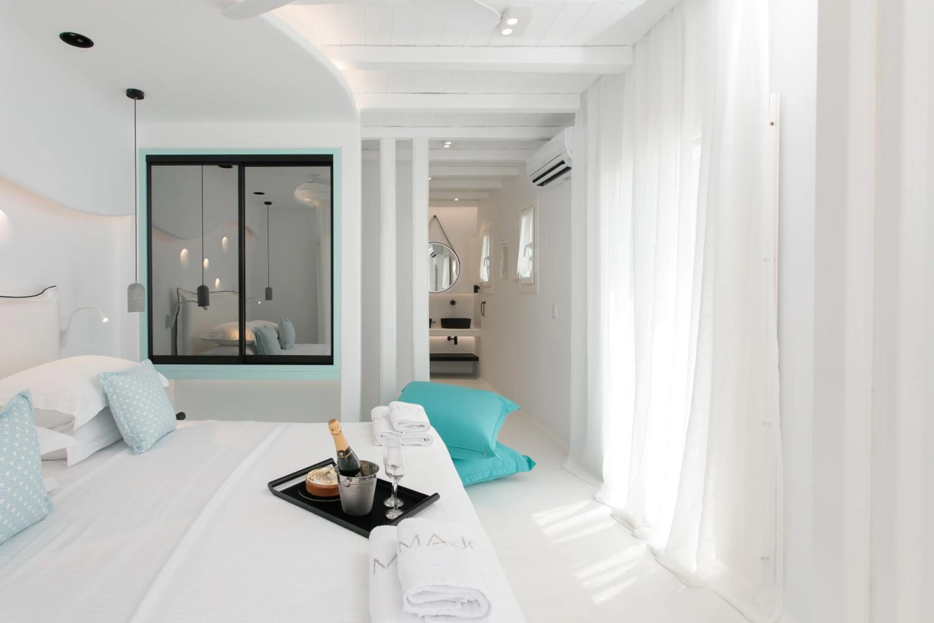 Bed in Majo Suites Hotel