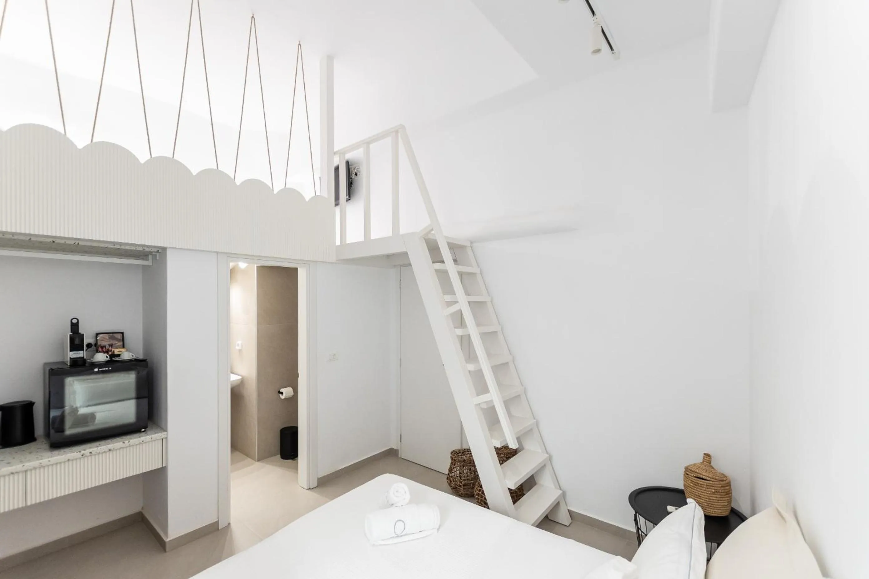 Bed in Majo Suites Hotel