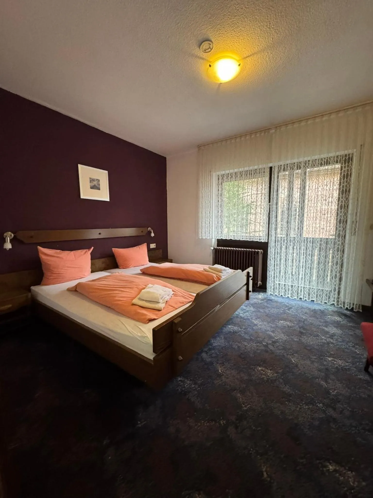 Bed in Hotel Grüner Baum - Melissone Italian Restaurant