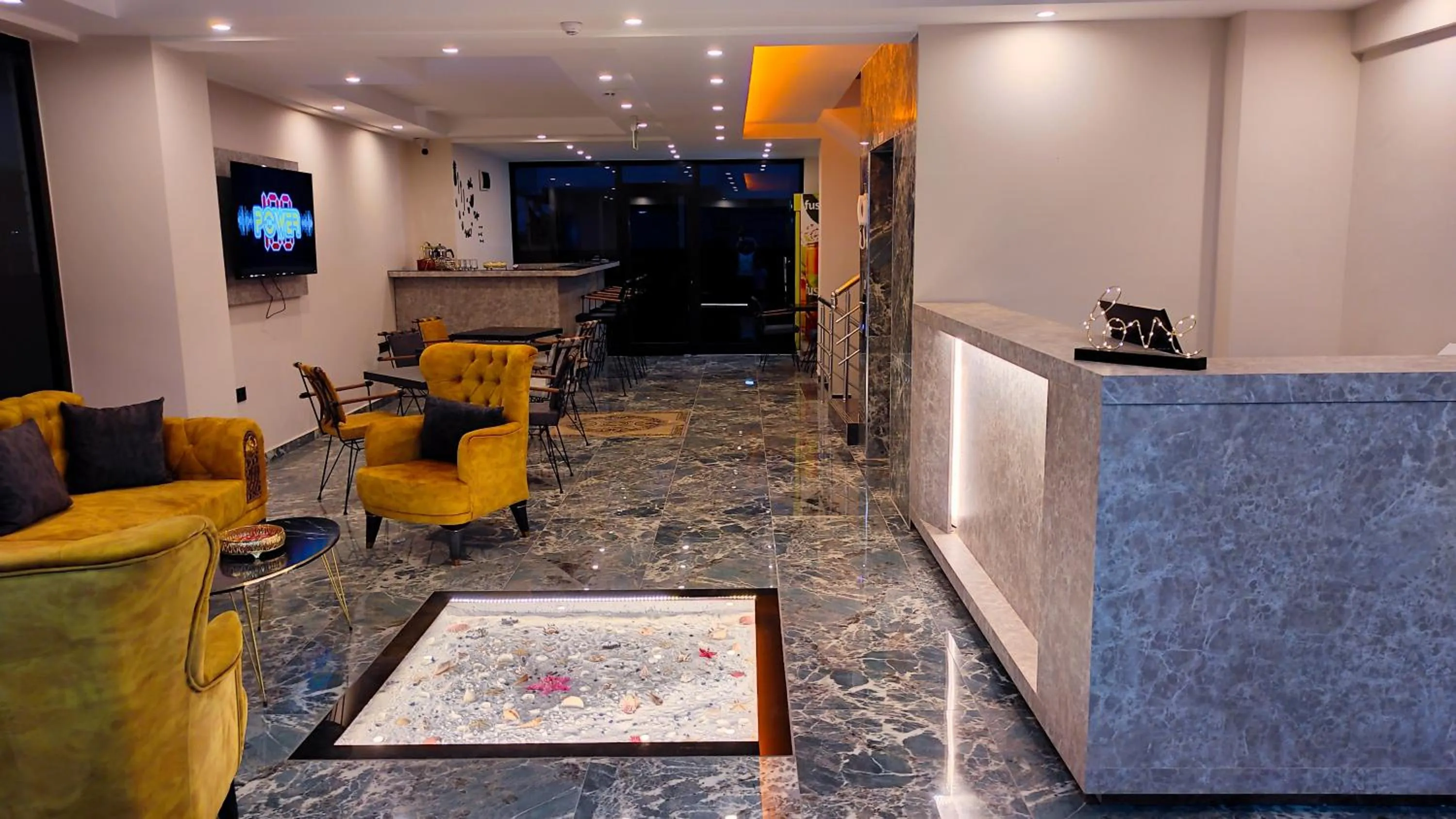 Communal lounge/ TV room in KALİSPERA HOTEL