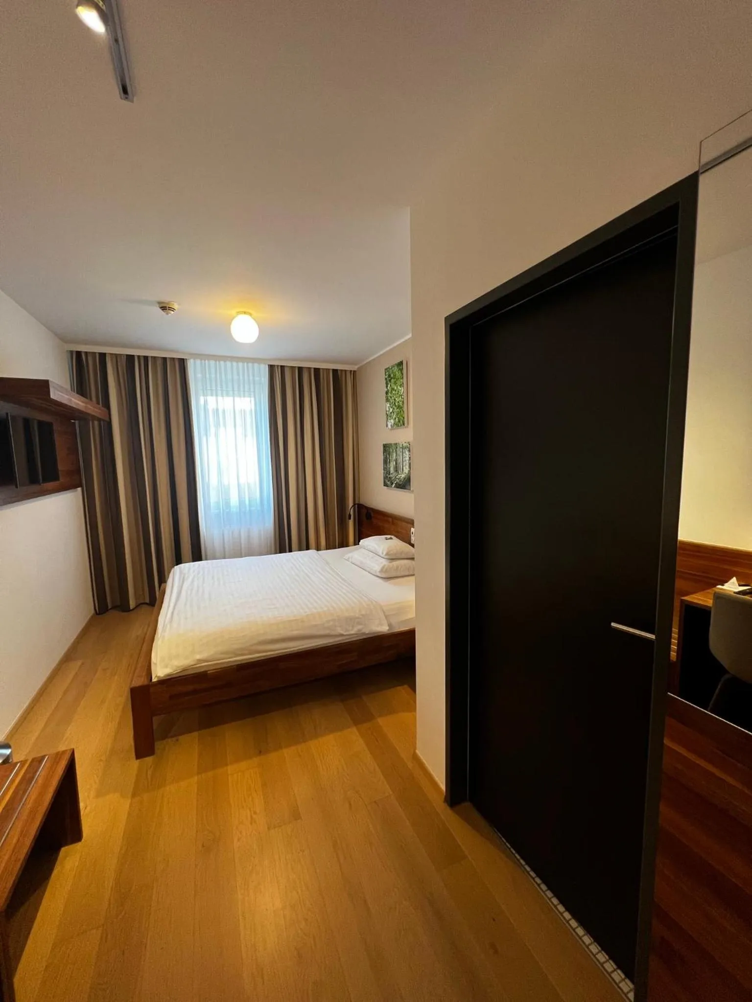 Photo of the whole room, Bed in H+ Hotel Ried