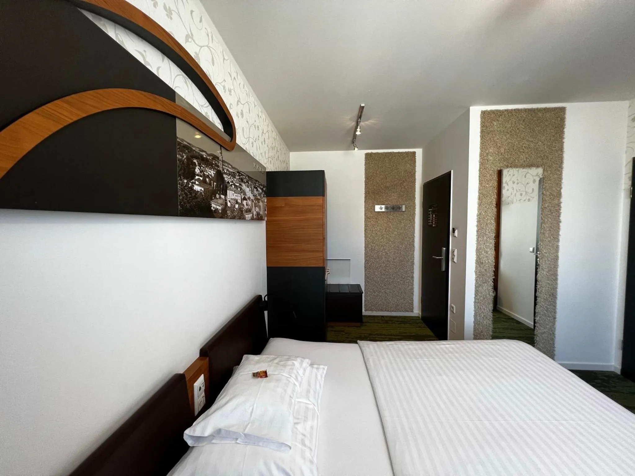 Photo of the whole room, Bed in H+ Hotel Ried