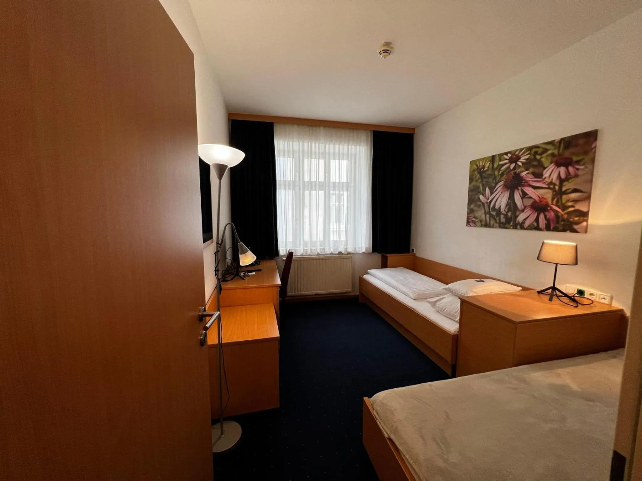 Photo of the whole room, Bed in H+ Hotel Ried