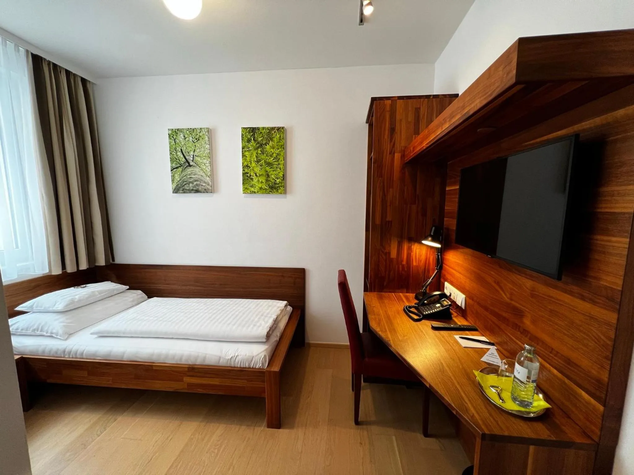 Photo of the whole room, Bed in H+ Hotel Ried