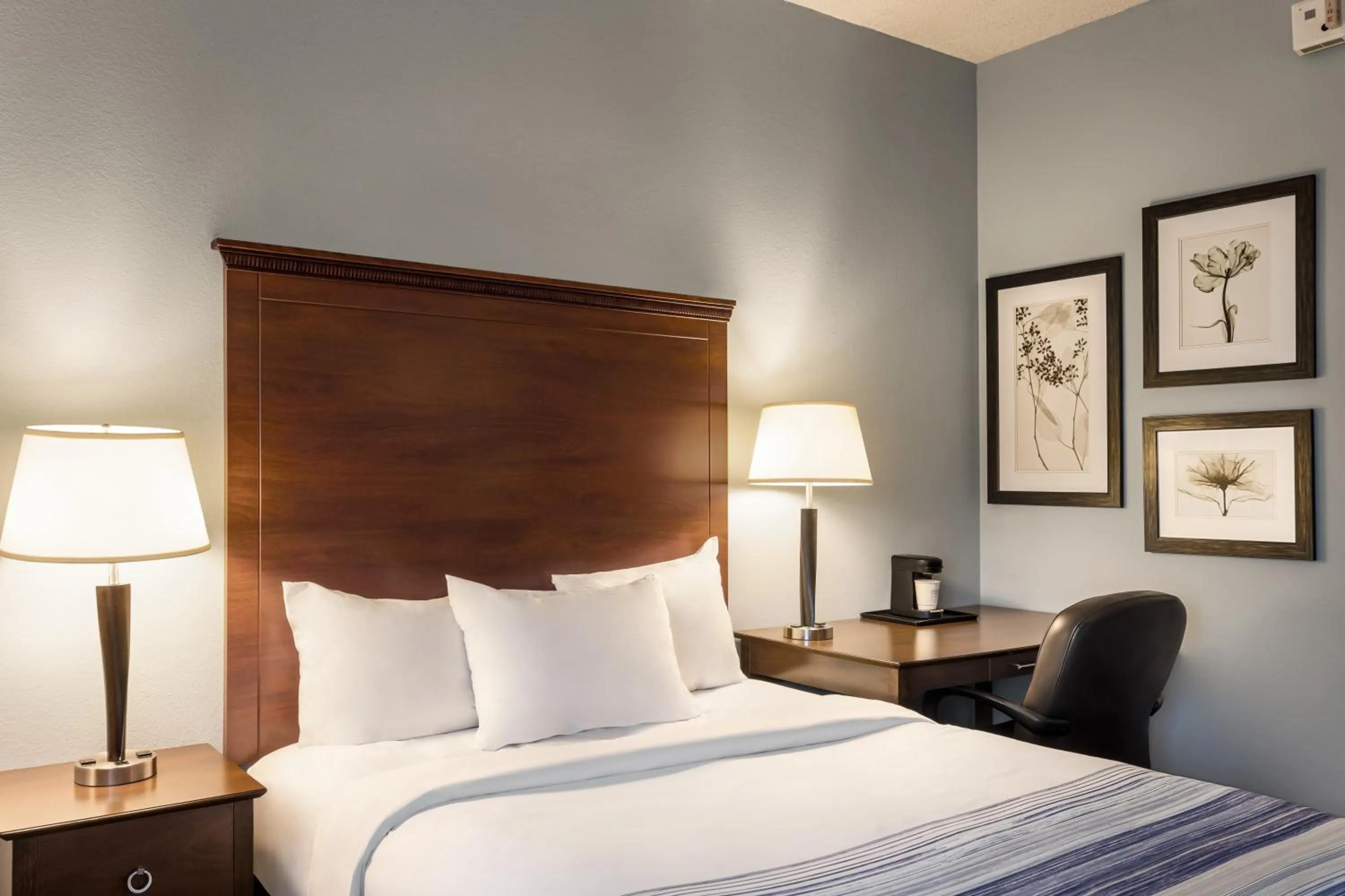 Bed in AmericInn by Wyndham Madison West