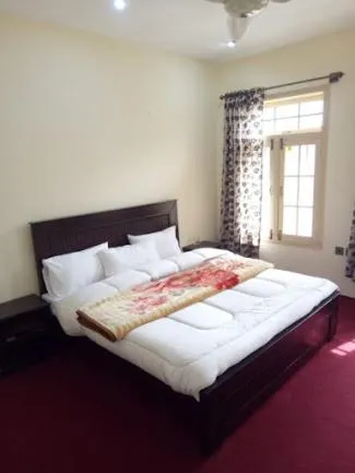 Bed in Hunza Regency Inn
