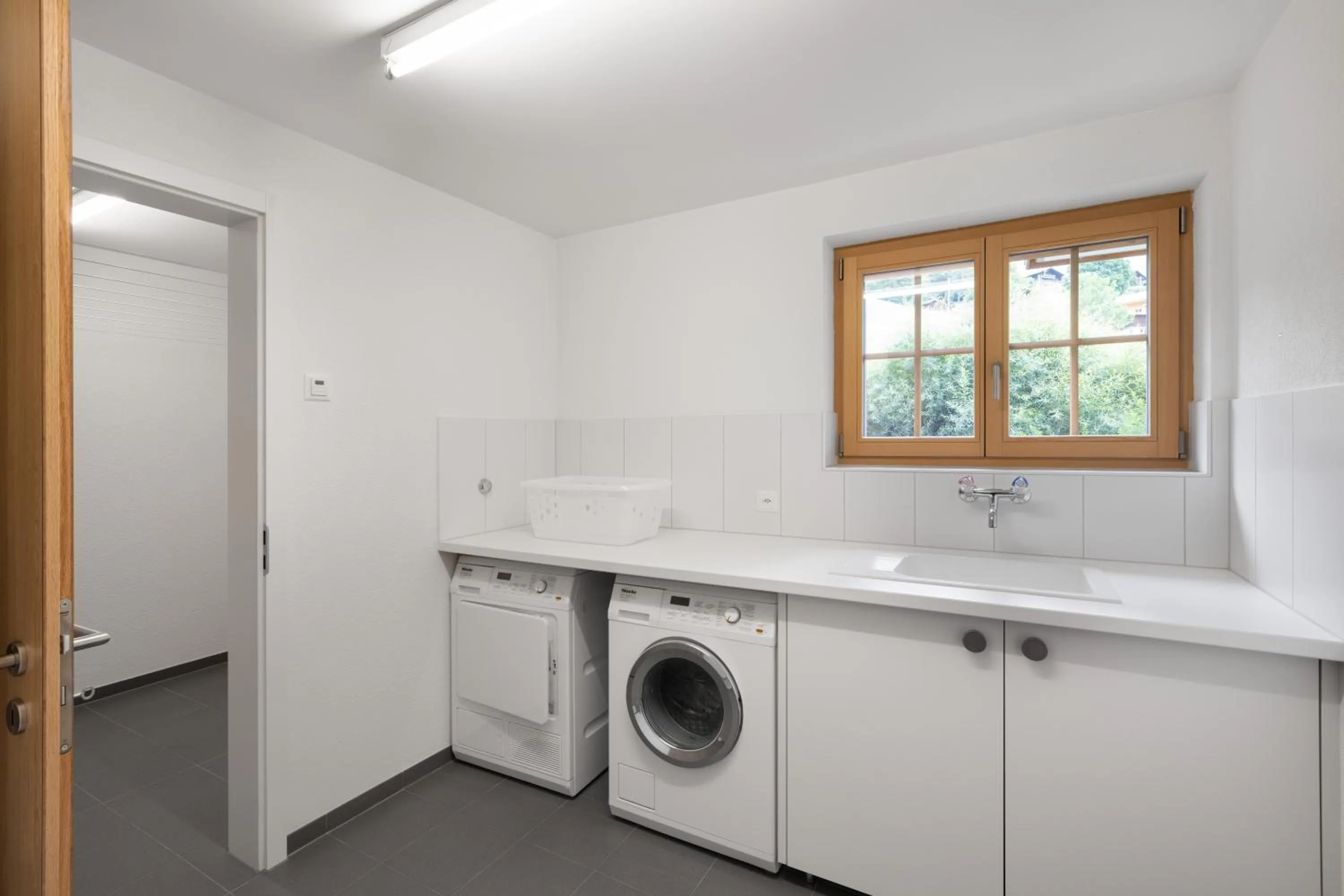 washing machine in Chalet Alia and Apartments-Grindelwald by Swiss Hotel Apartments