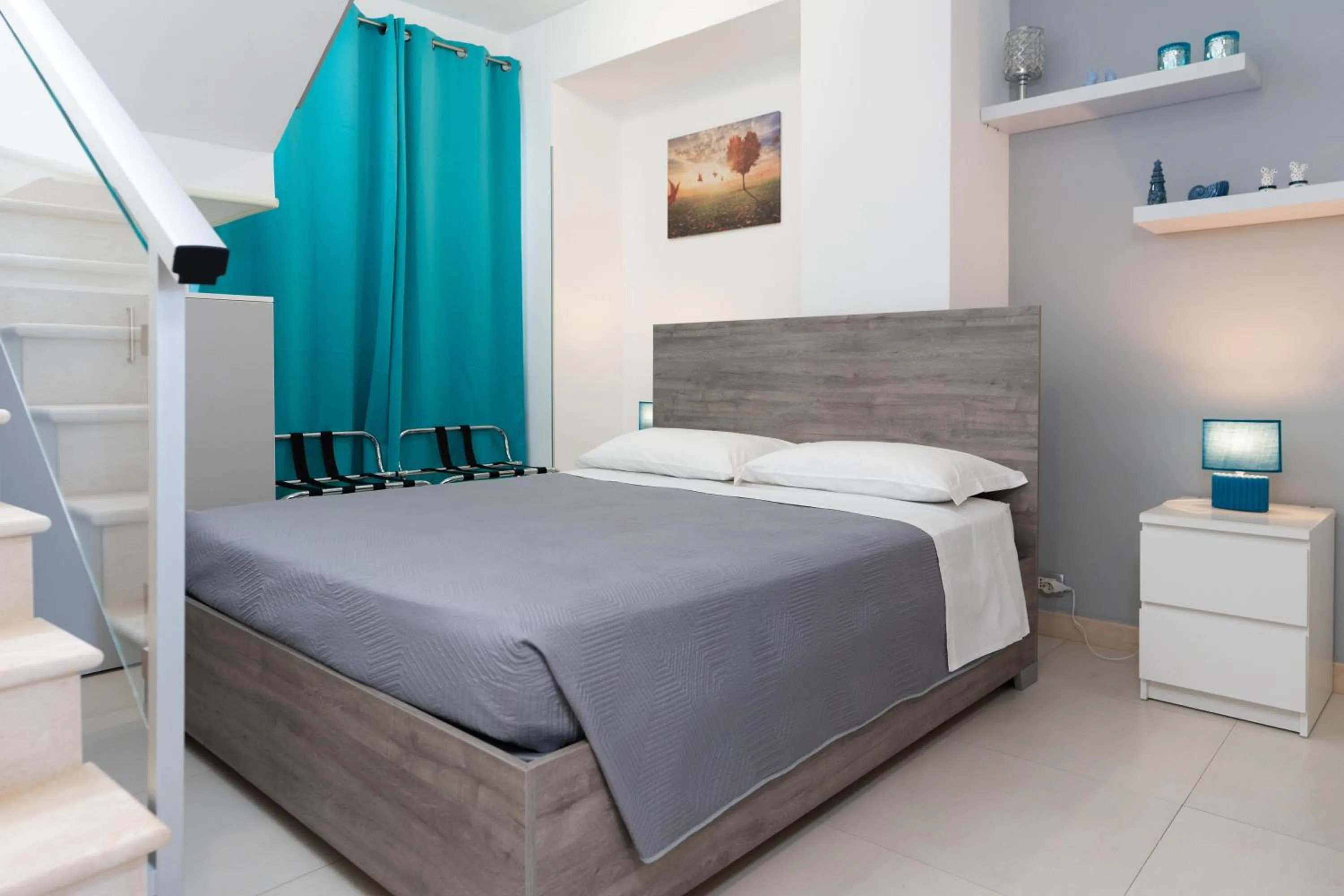 Bed in MADAGÌ Beachfront Apartments