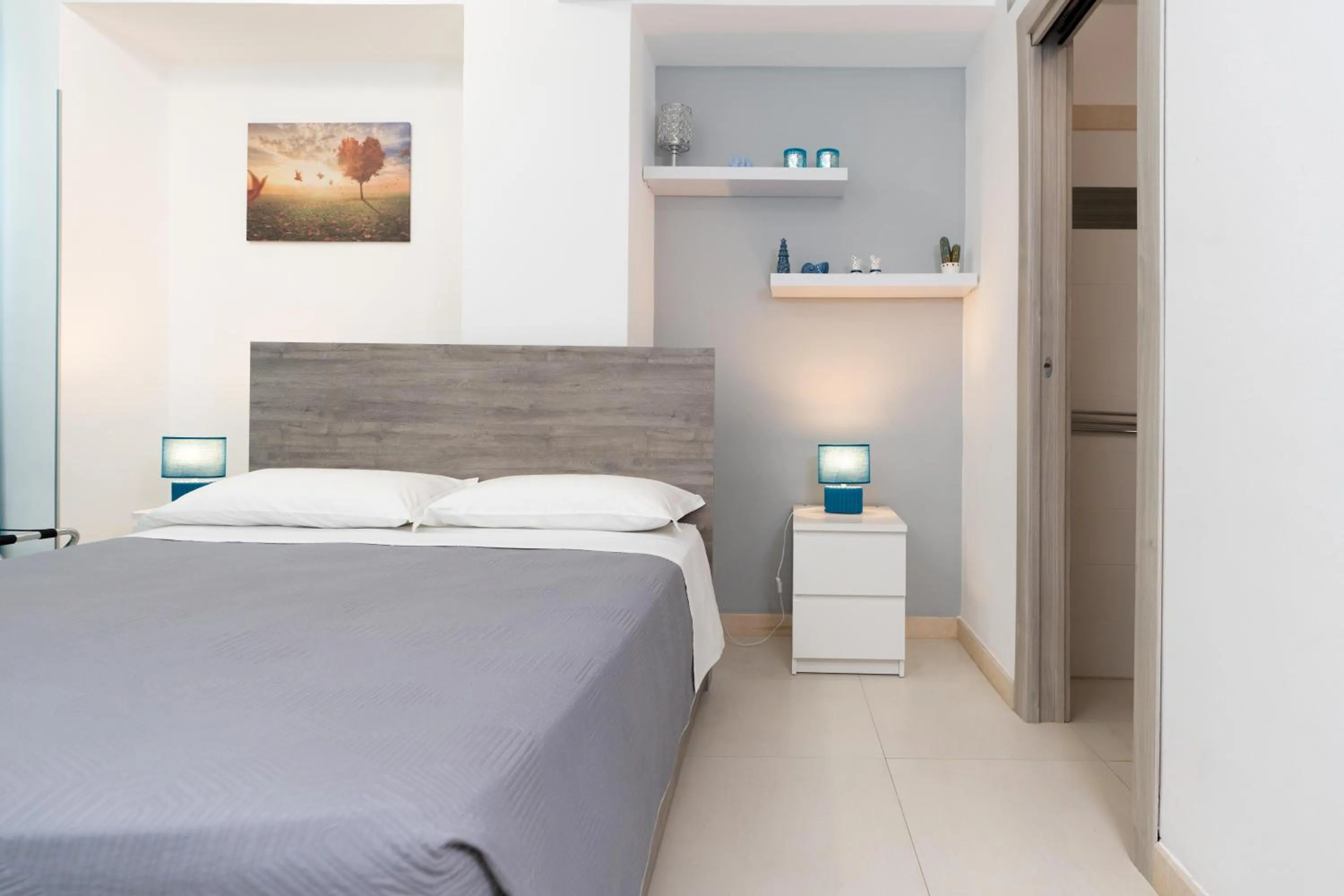 Bed in MADAGÌ Beachfront Apartments