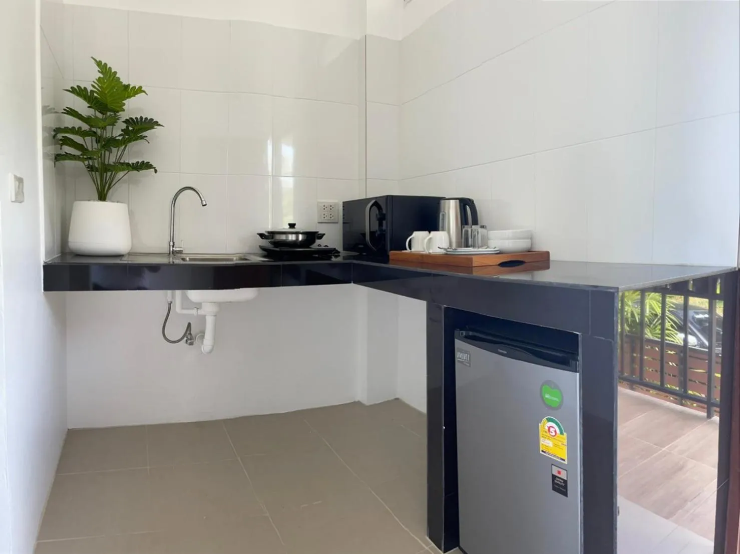 Kitchen or kitchenette in Pure Laguna Residence by Nice Sea Resort