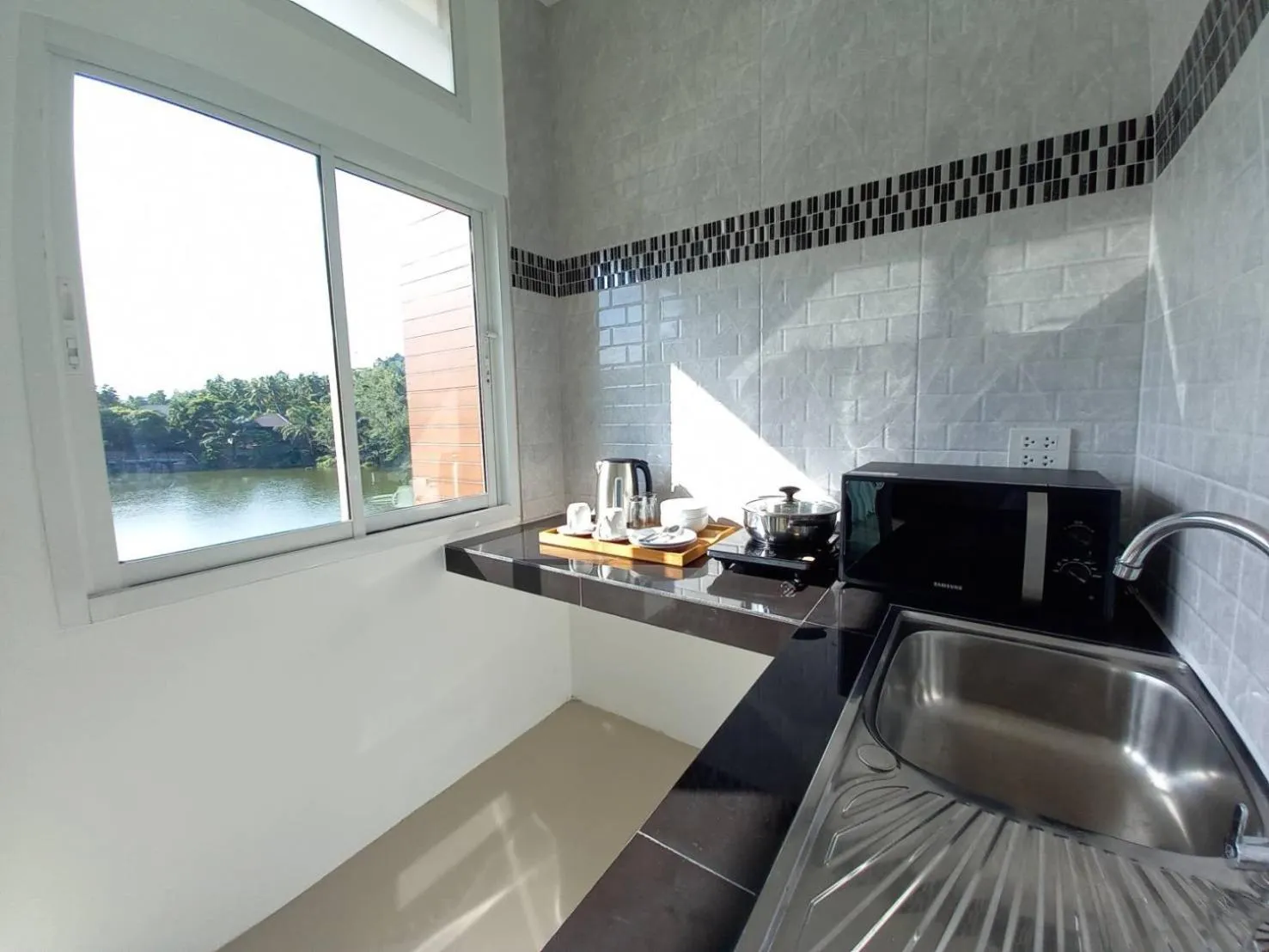Kitchen or kitchenette in Pure Laguna Residence by Nice Sea Resort