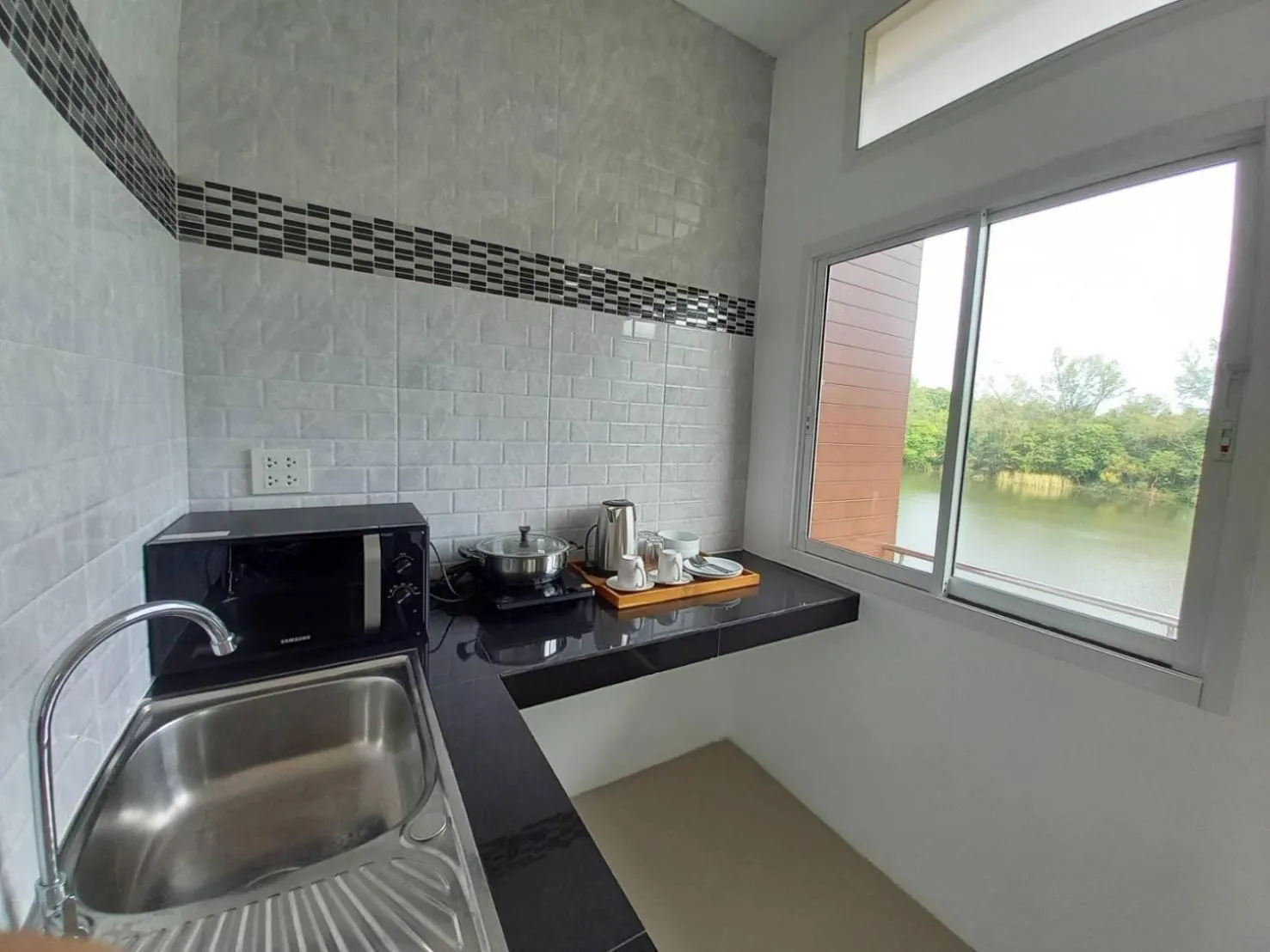 Kitchen or kitchenette in Pure Laguna Residence by Nice Sea Resort