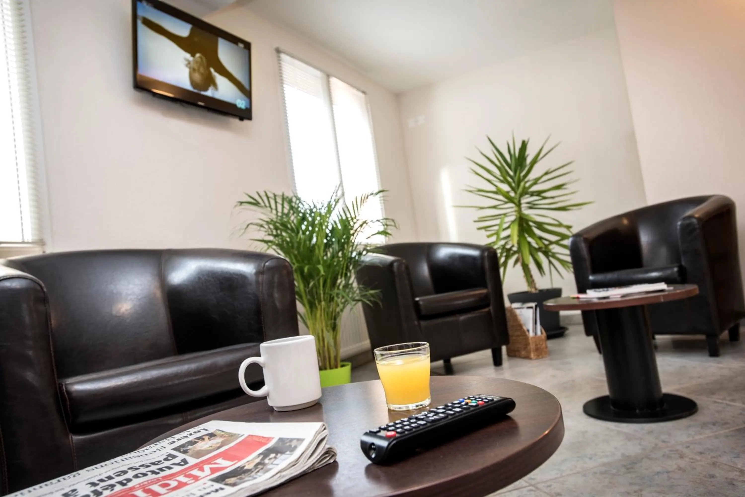 Communal lounge/ TV room in Brit Hotel Essentiel Deltour Mende