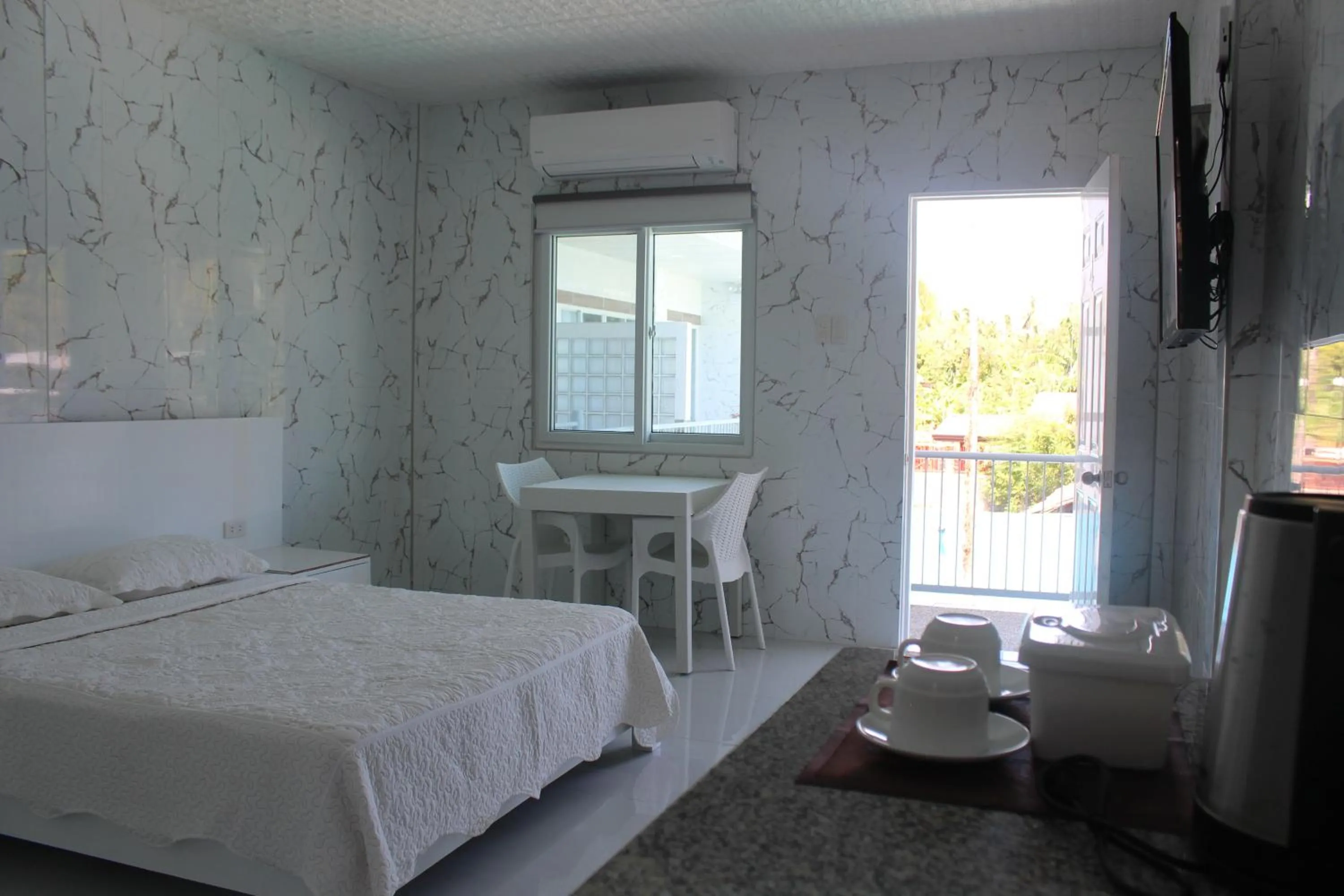 Bed in Sena Gladyz Suites