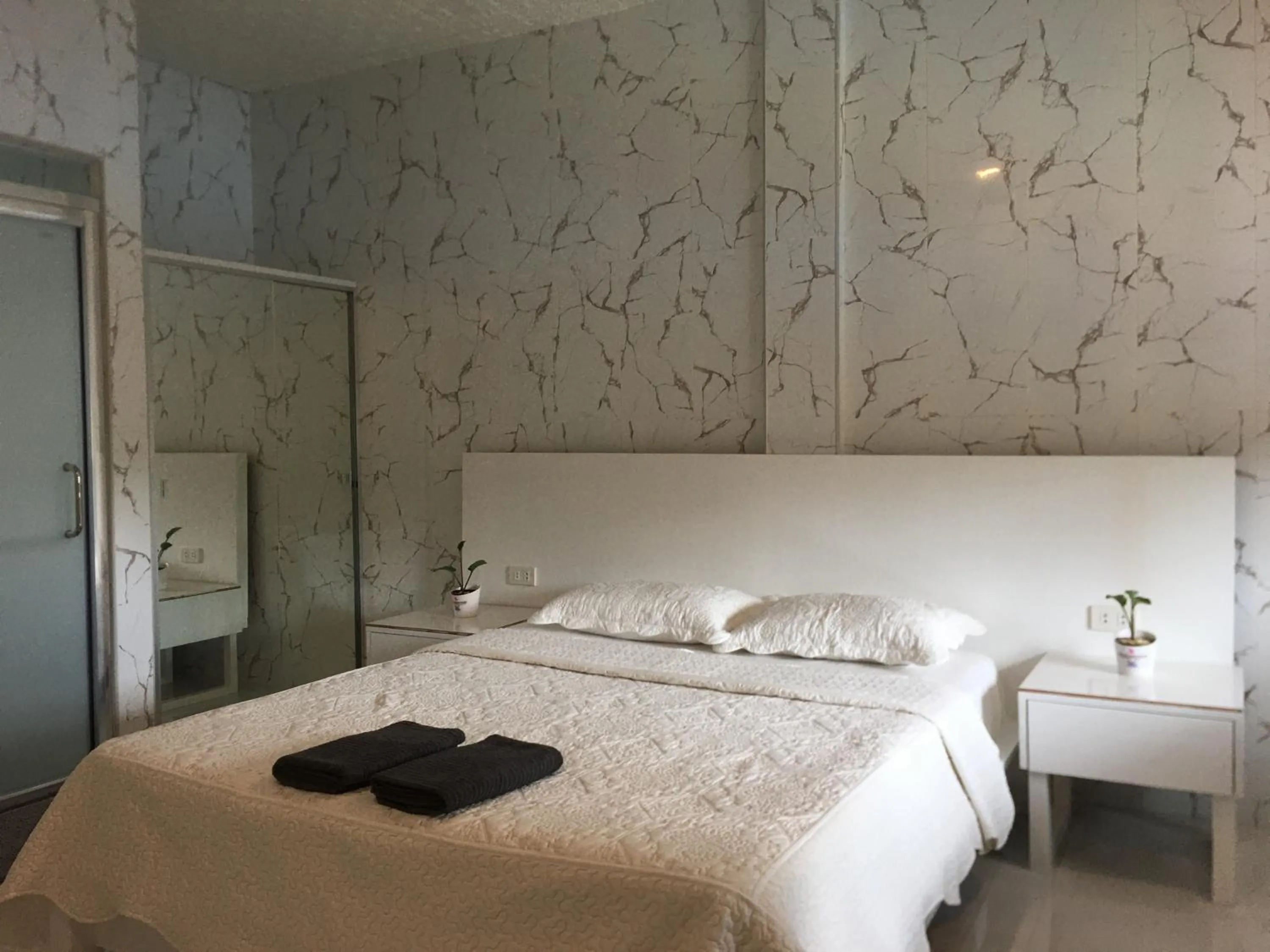 Bed in Sena Gladyz Suites