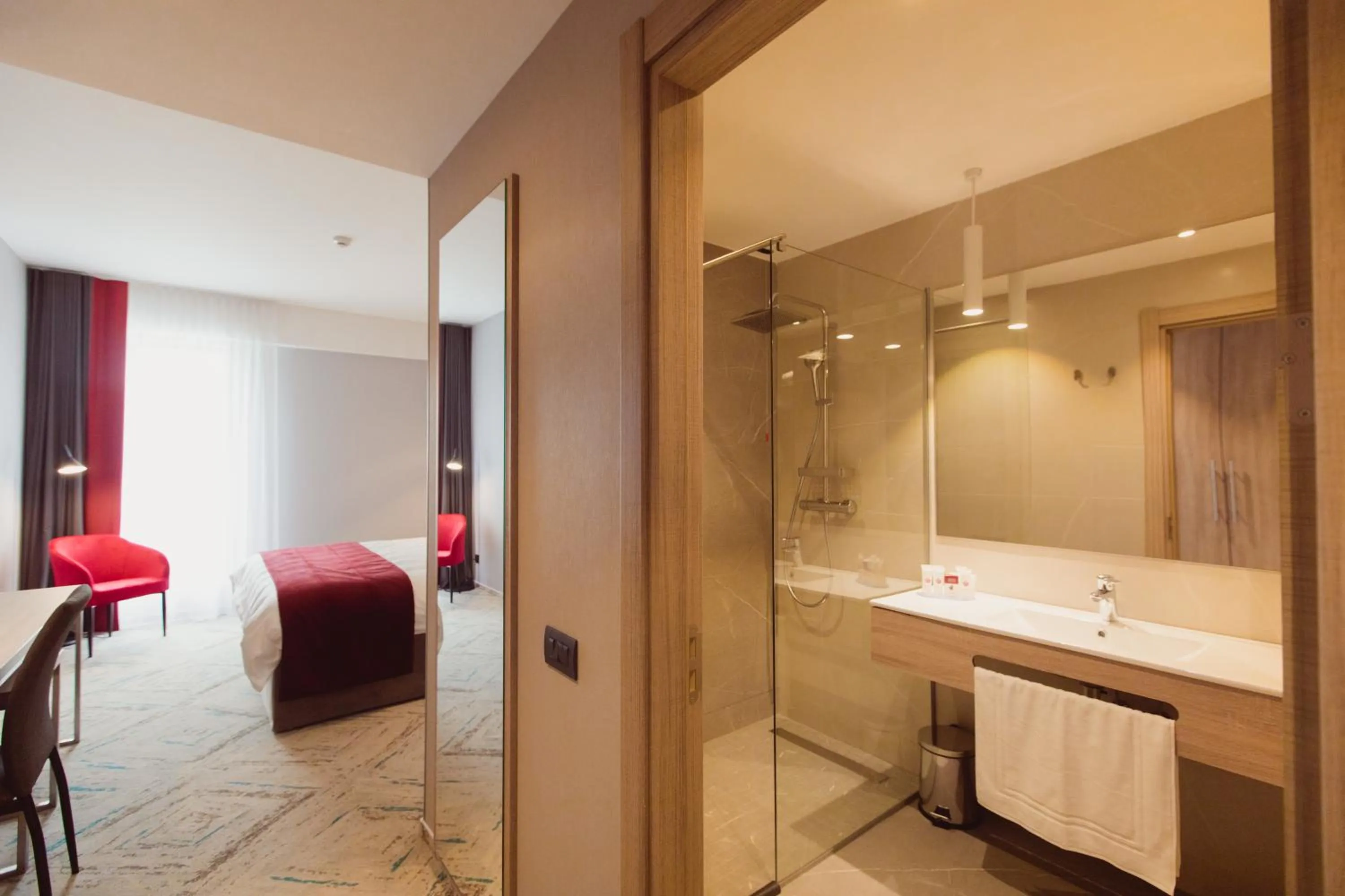 Bathroom, Bed in Ramada by Wyndham Targu Jiu
