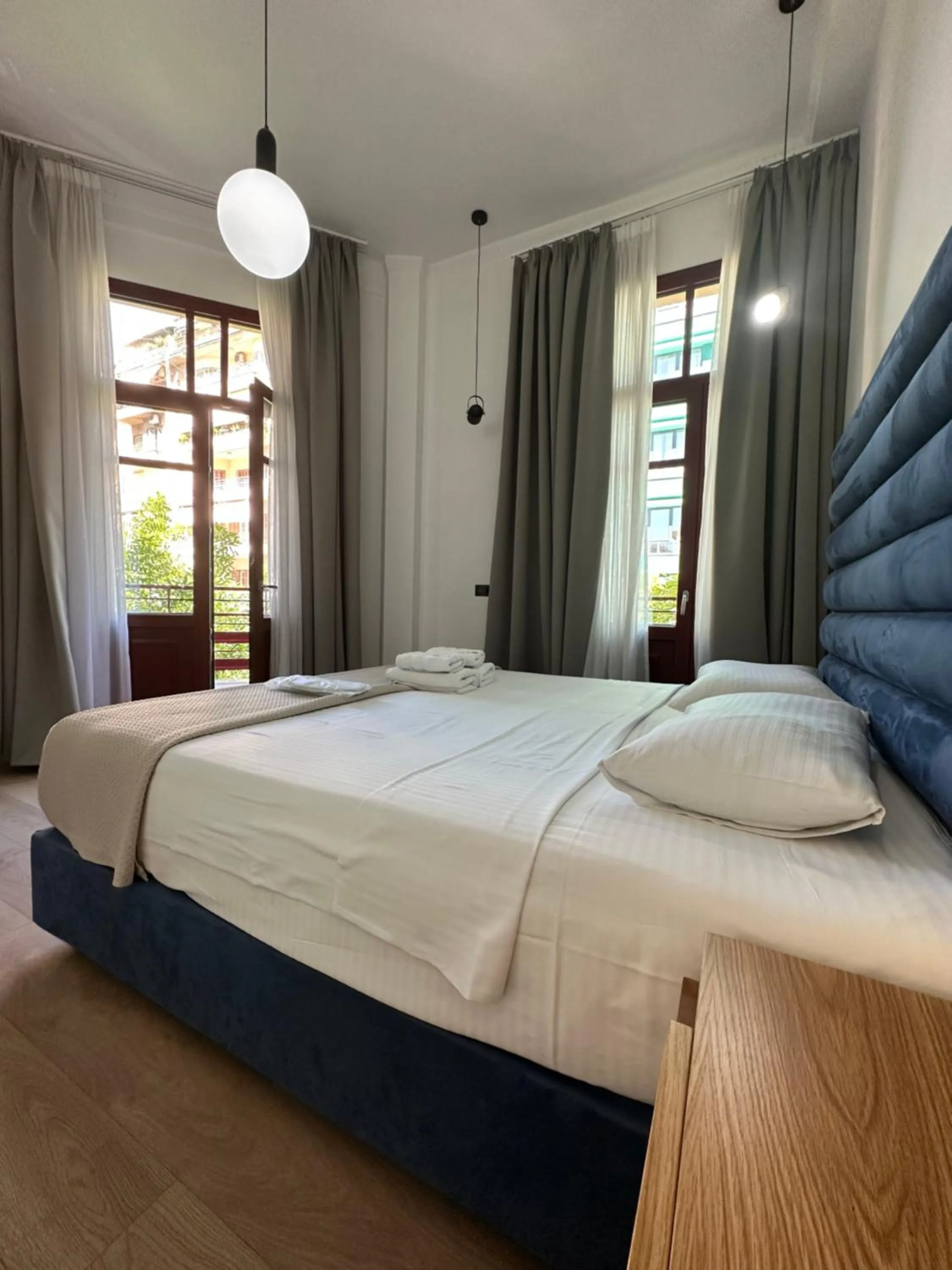 Bed in The Maroon Bottle Luxury Suites