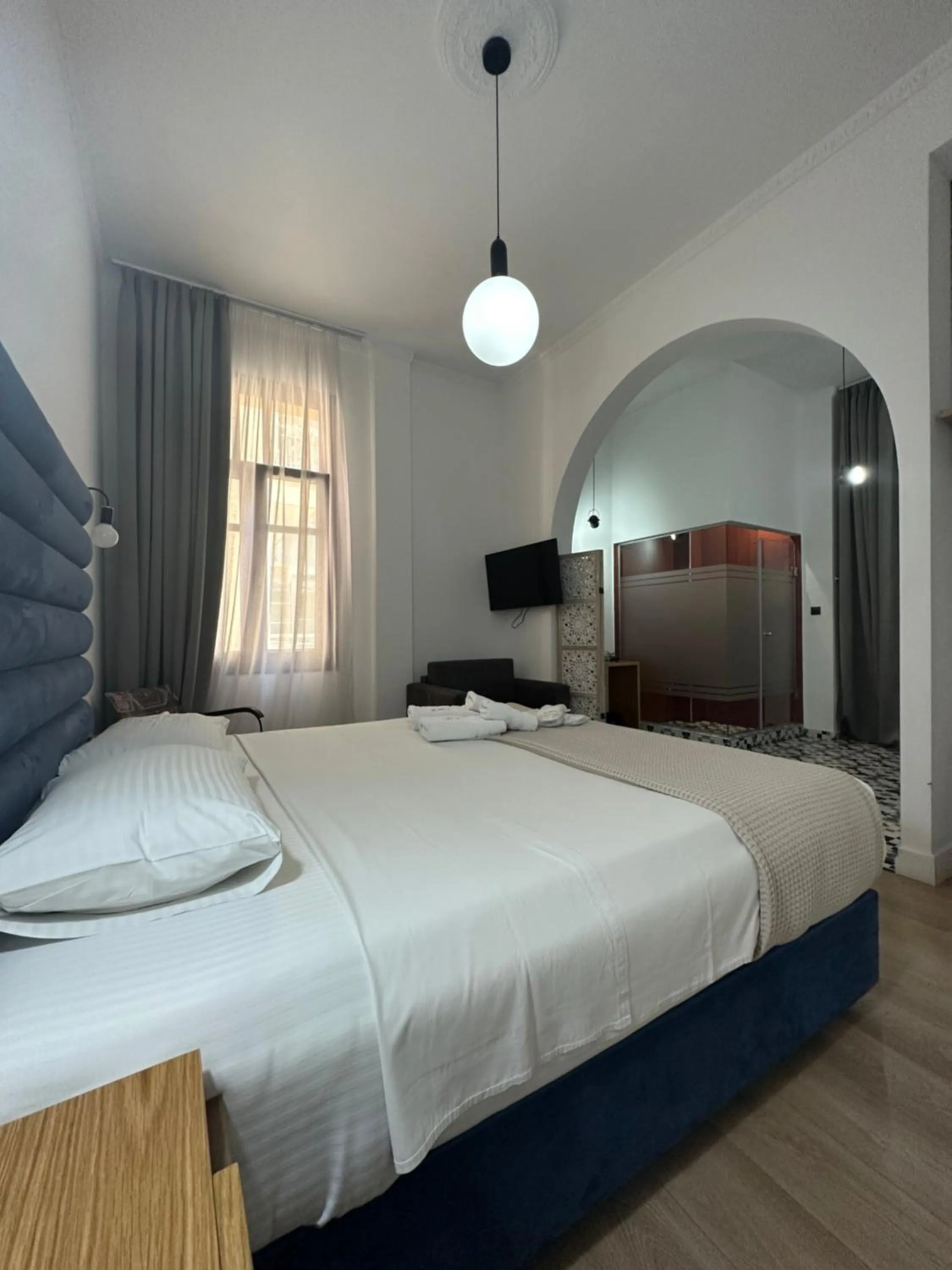 Toilet, Bed in The Maroon Bottle Luxury Suites