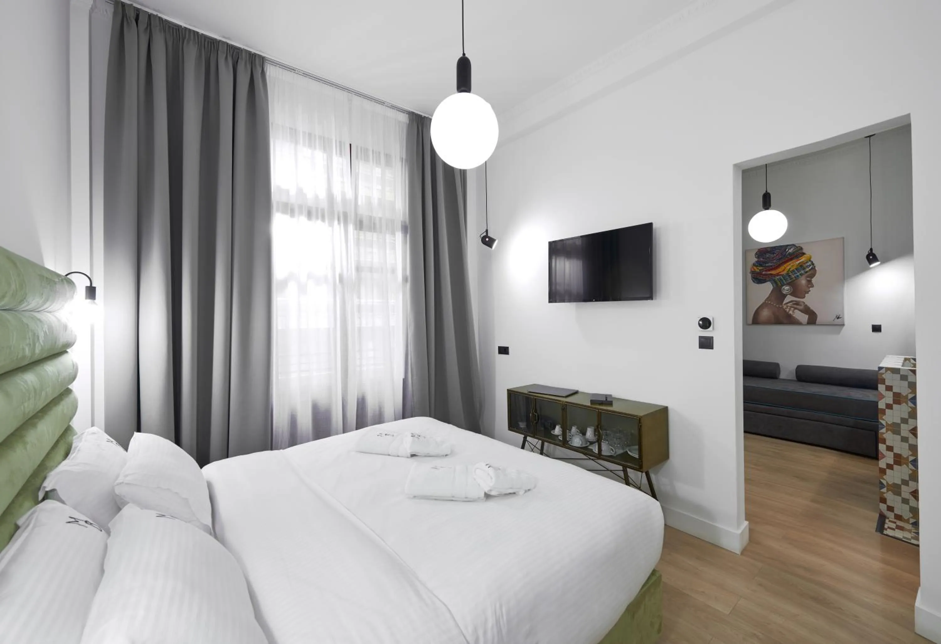 Bed in The Maroon Bottle Luxury Suites