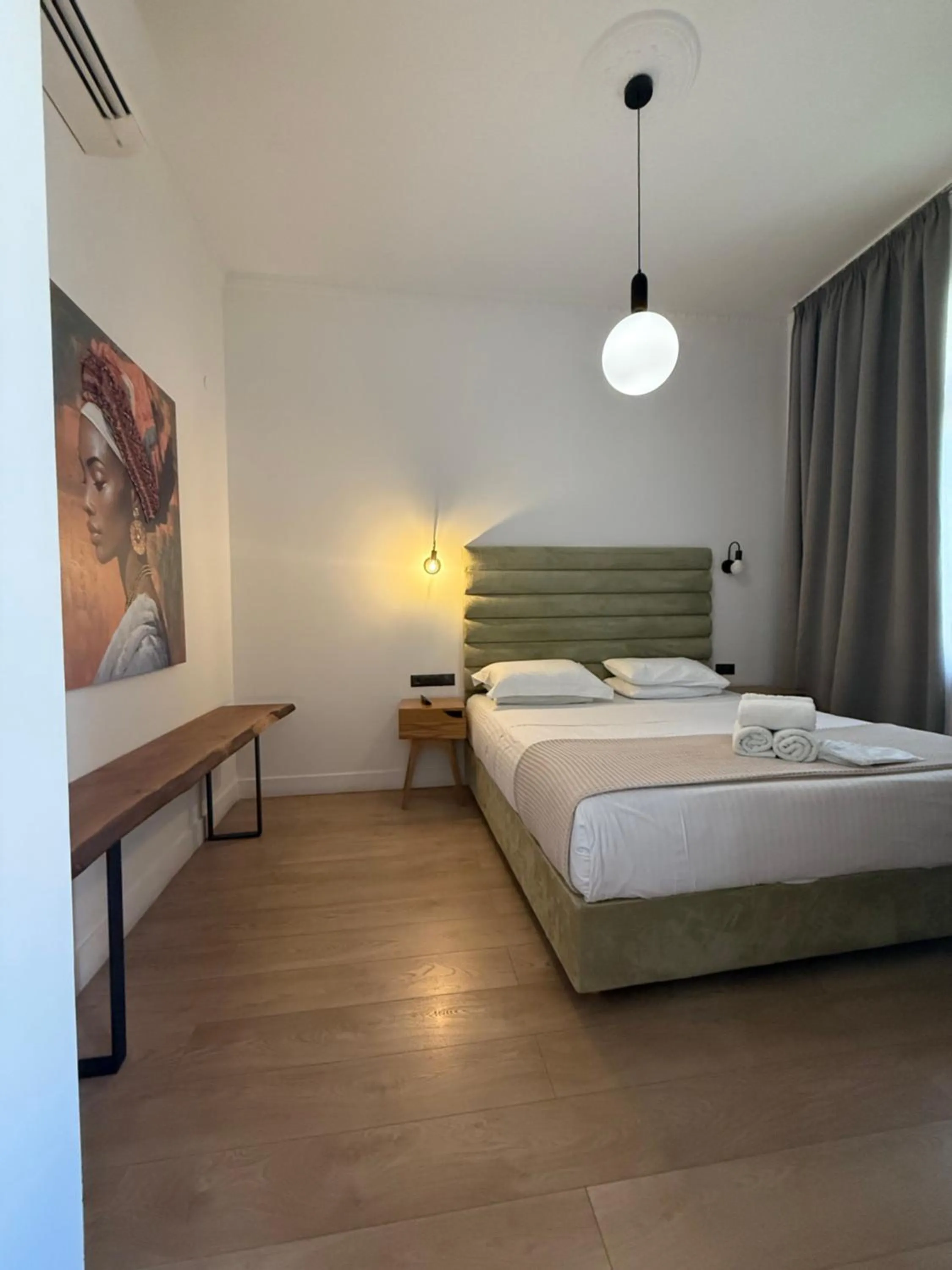 Bed in The Maroon Bottle Luxury Suites