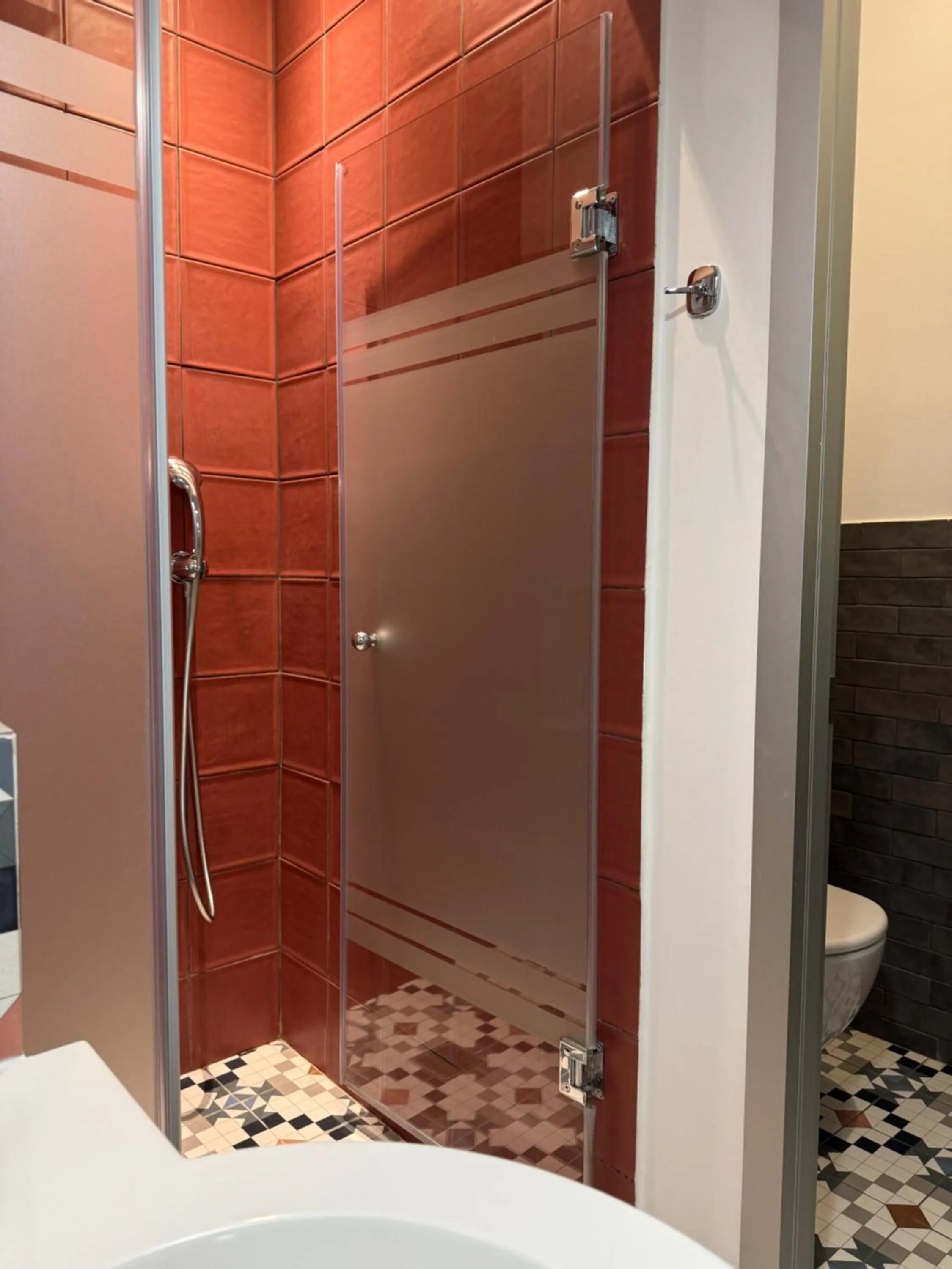 Shower in The Maroon Bottle Luxury Suites