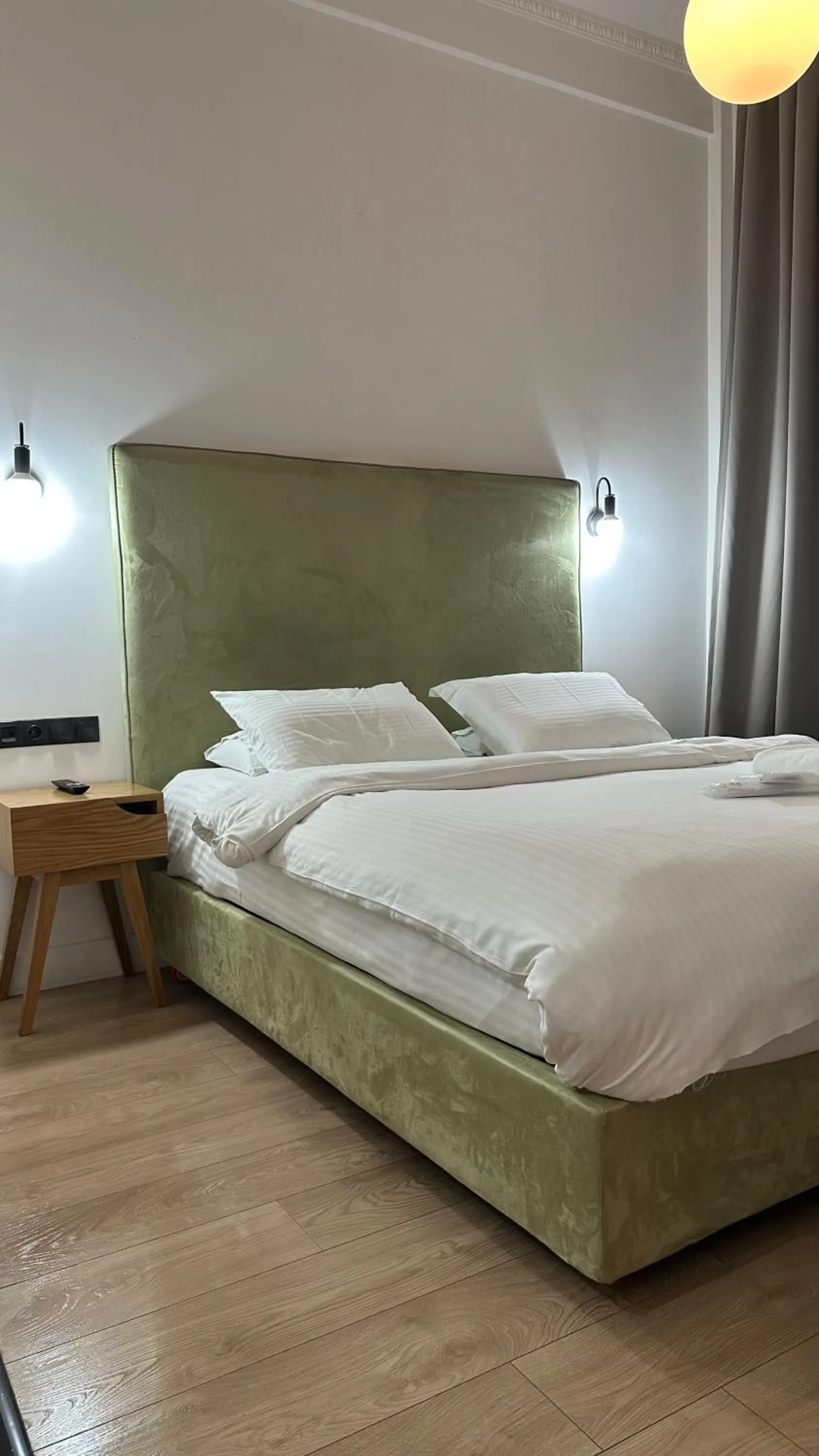 Bed in The Maroon Bottle Luxury Suites