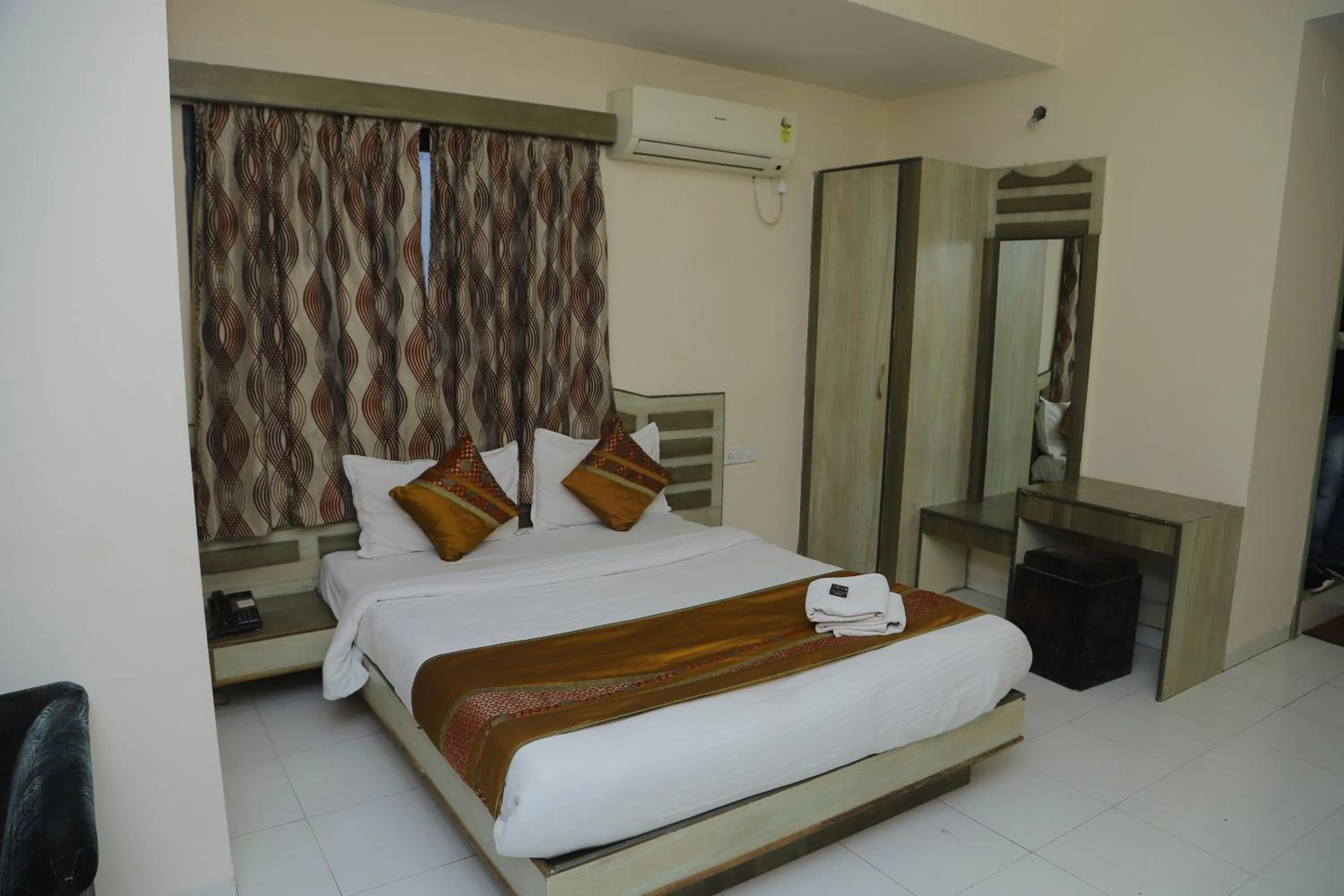 Bed in Hotel Grand Tower