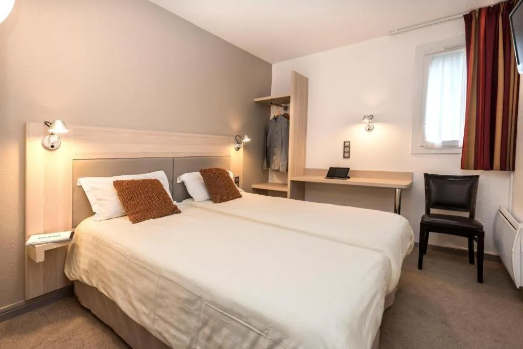 Photo of the whole room, Bed in Brit Hotel Confort Deltour Mende